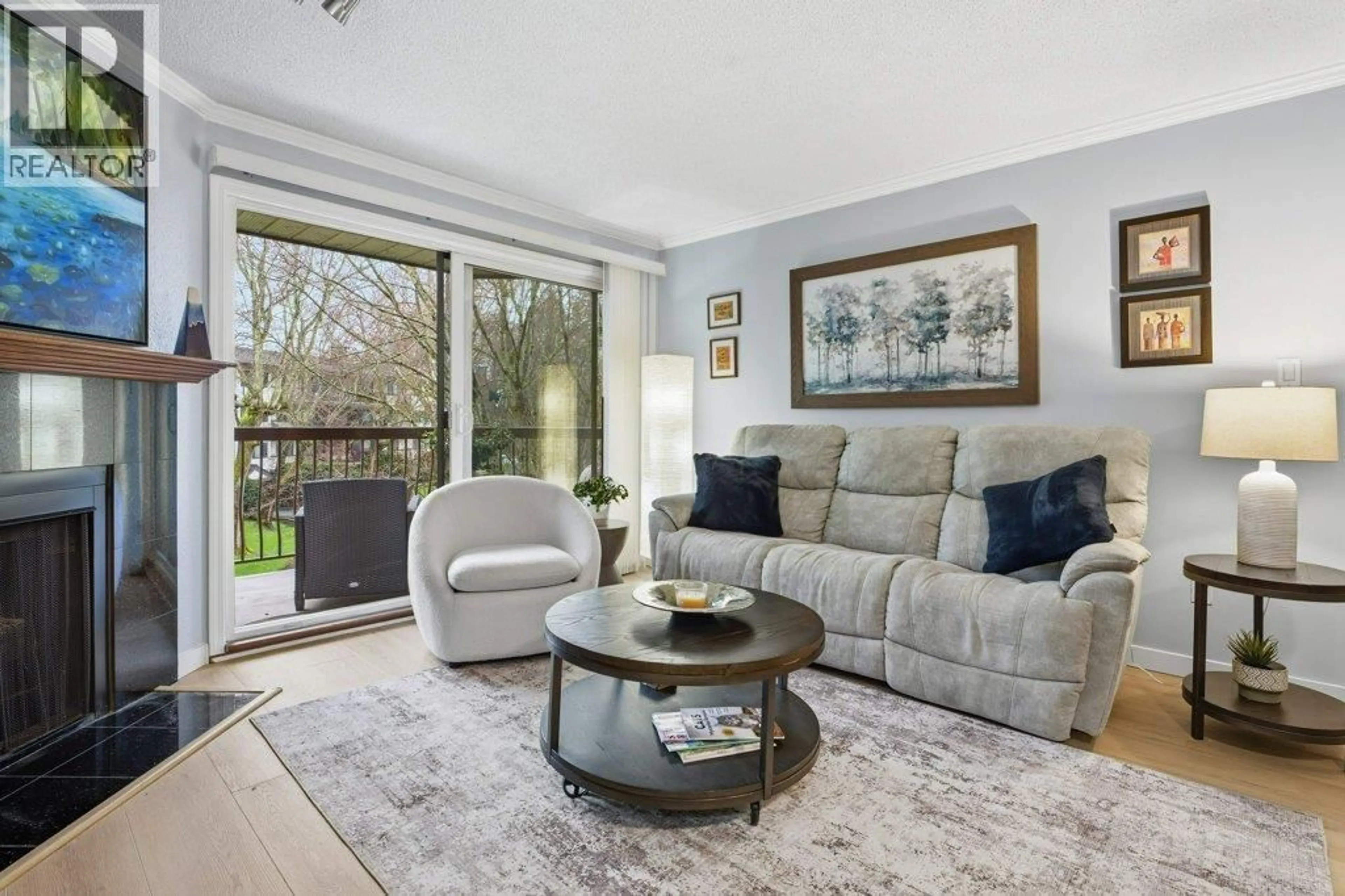 Living room with furniture, wood/laminate floor for 207 - 10220 RYAN ROAD, Richmond British Columbia V7A4R1