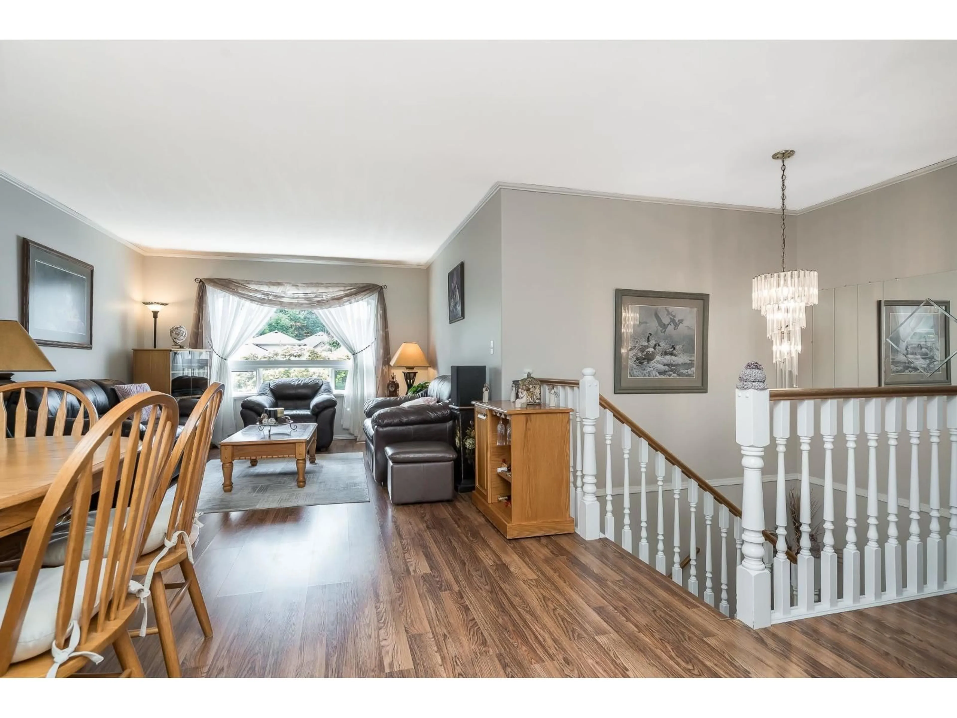 Living room with furniture, wood/laminate floor for 10067 MERRITT DRIVE, Chilliwack British Columbia V2P7Z2