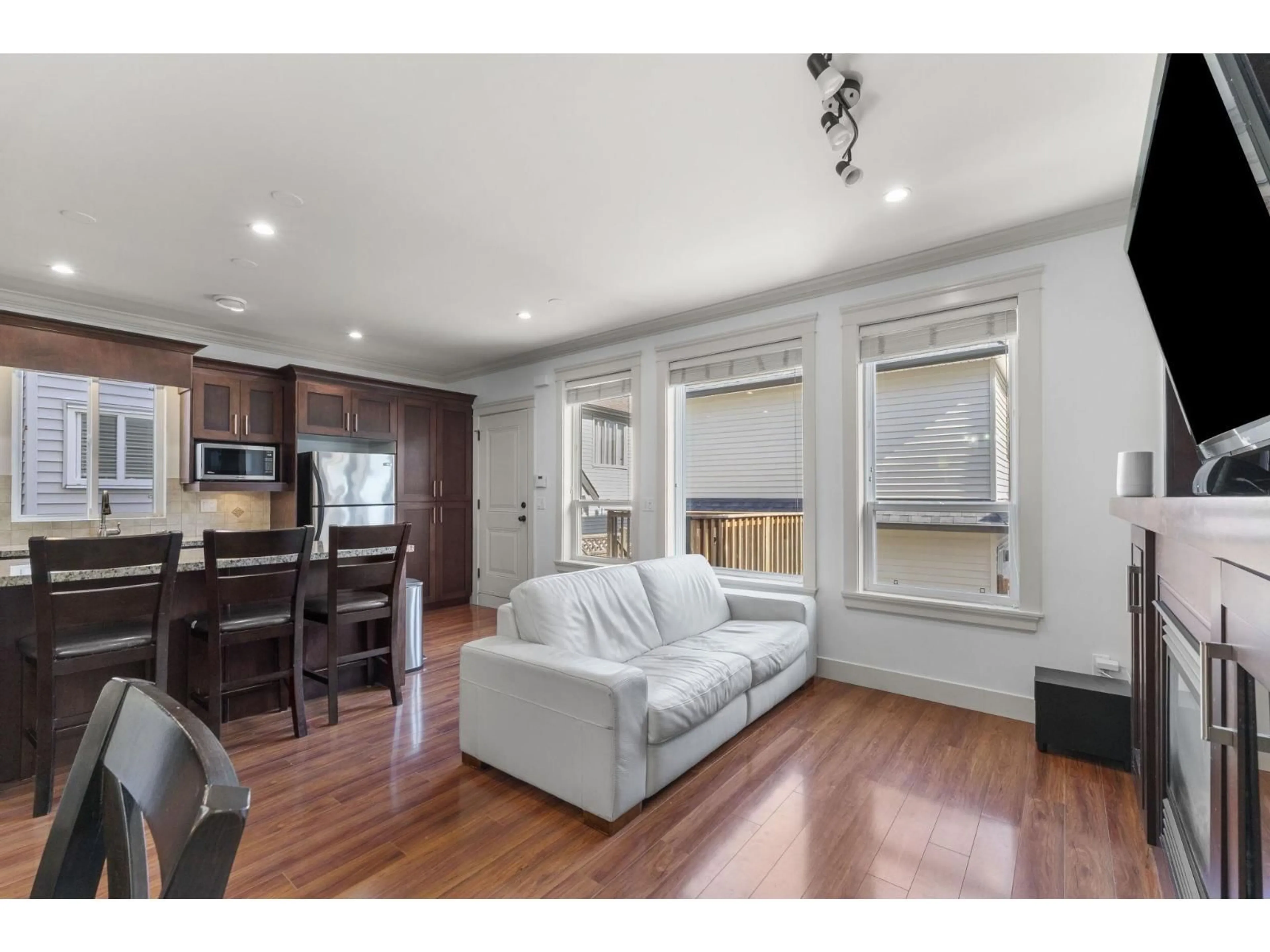 Living room with furniture, wood/laminate floor for 6746 191A STREET, Surrey British Columbia V4N6A5