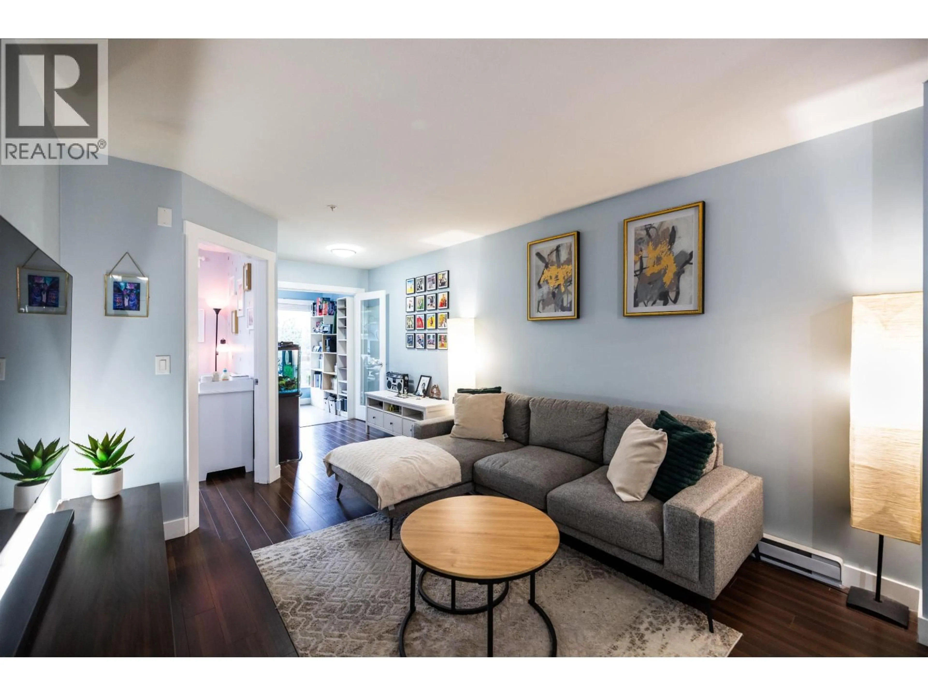 Living room with furniture, wood/laminate floor for 312 - 1239 KINGSWAY STREET, Vancouver British Columbia V5V3E2