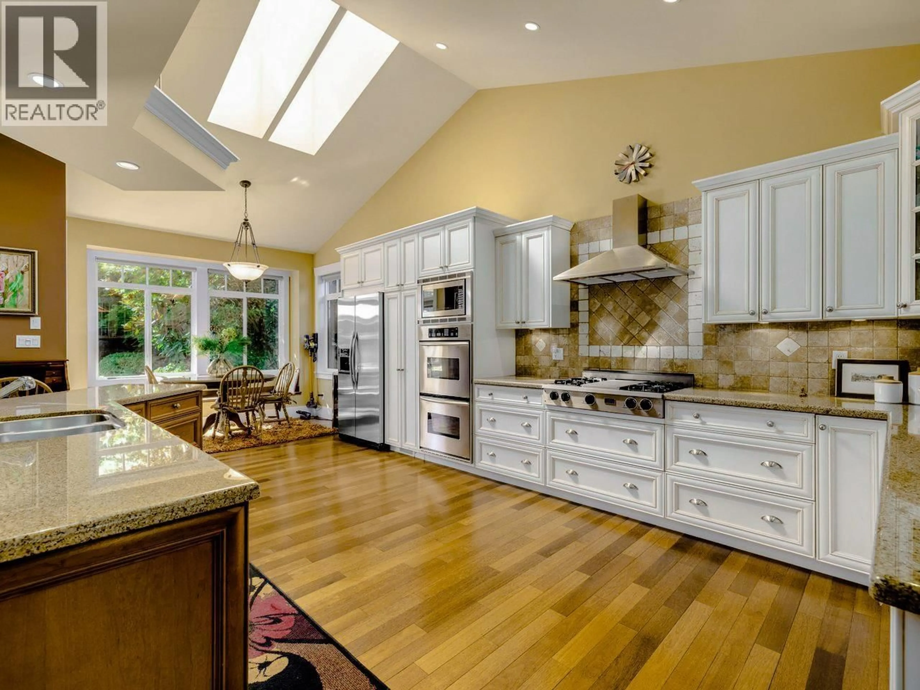 Open concept kitchen, ceramic/tile floor for 4950 1 AVENUE, Delta British Columbia V4M1B3