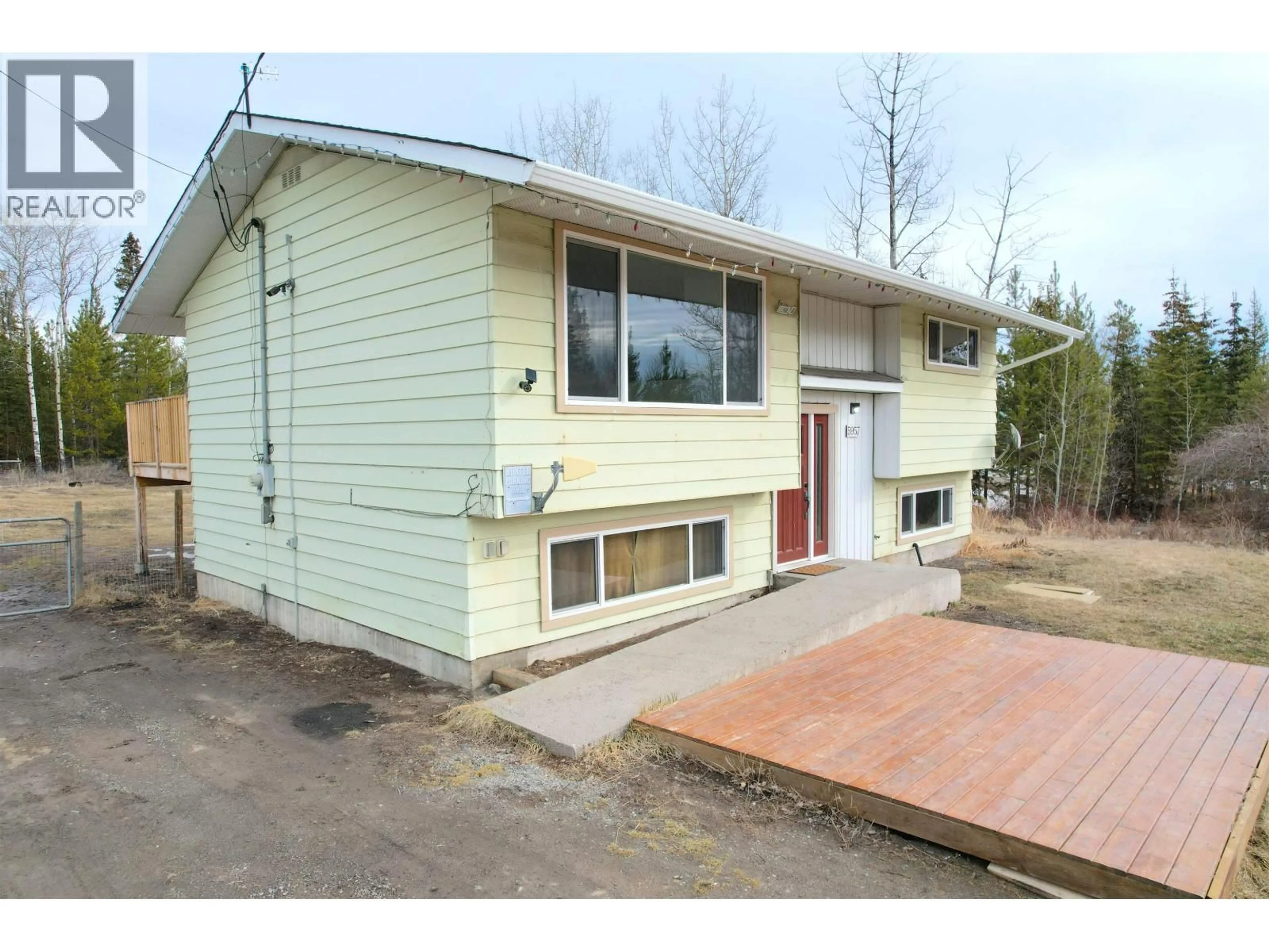 Home with vinyl exterior material, street for 5957 LITTLE FORT 24 HIGHWAY, 100 Mile House British Columbia V0K1X0