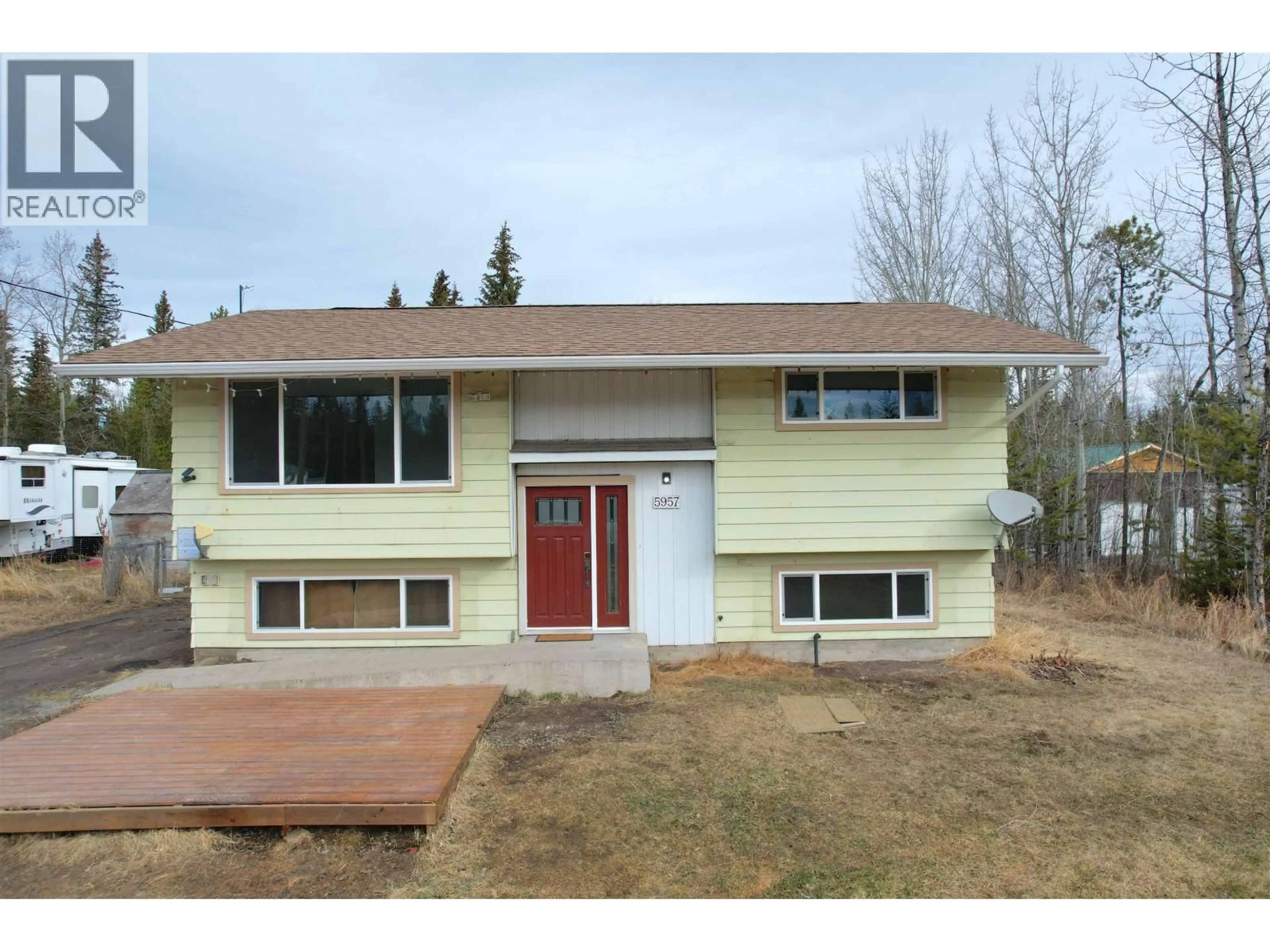 Home with vinyl exterior material, street for 5957 LITTLE FORT 24 HIGHWAY, 100 Mile House British Columbia V0K1X0