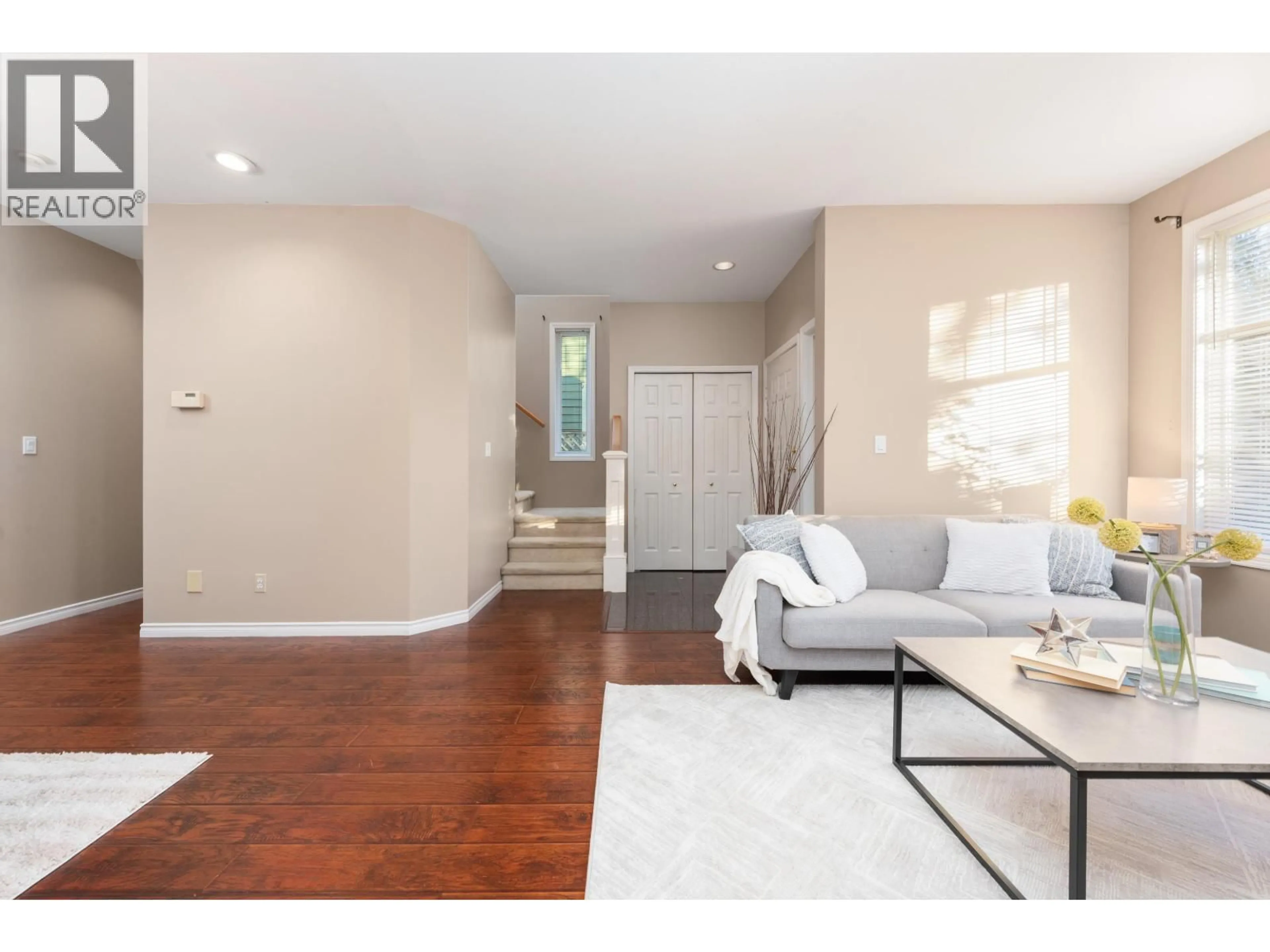 Living room with furniture, wood/laminate floor for 10231 CAMBIE ROAD, Richmond British Columbia V6X4A4