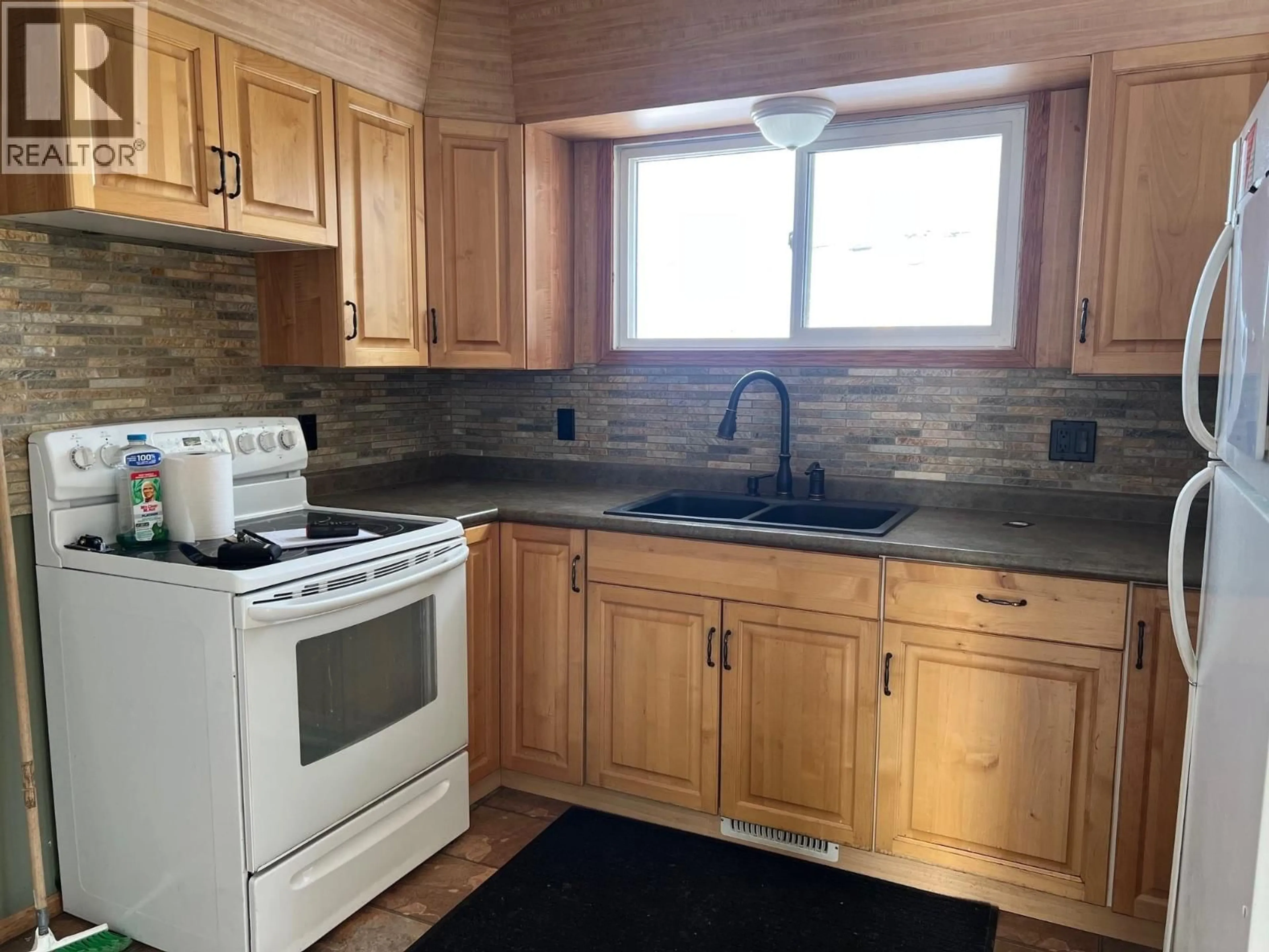 Standard kitchen, wood/laminate floor for 12261 242 ROAD, Fort St. John British Columbia V1J4M7