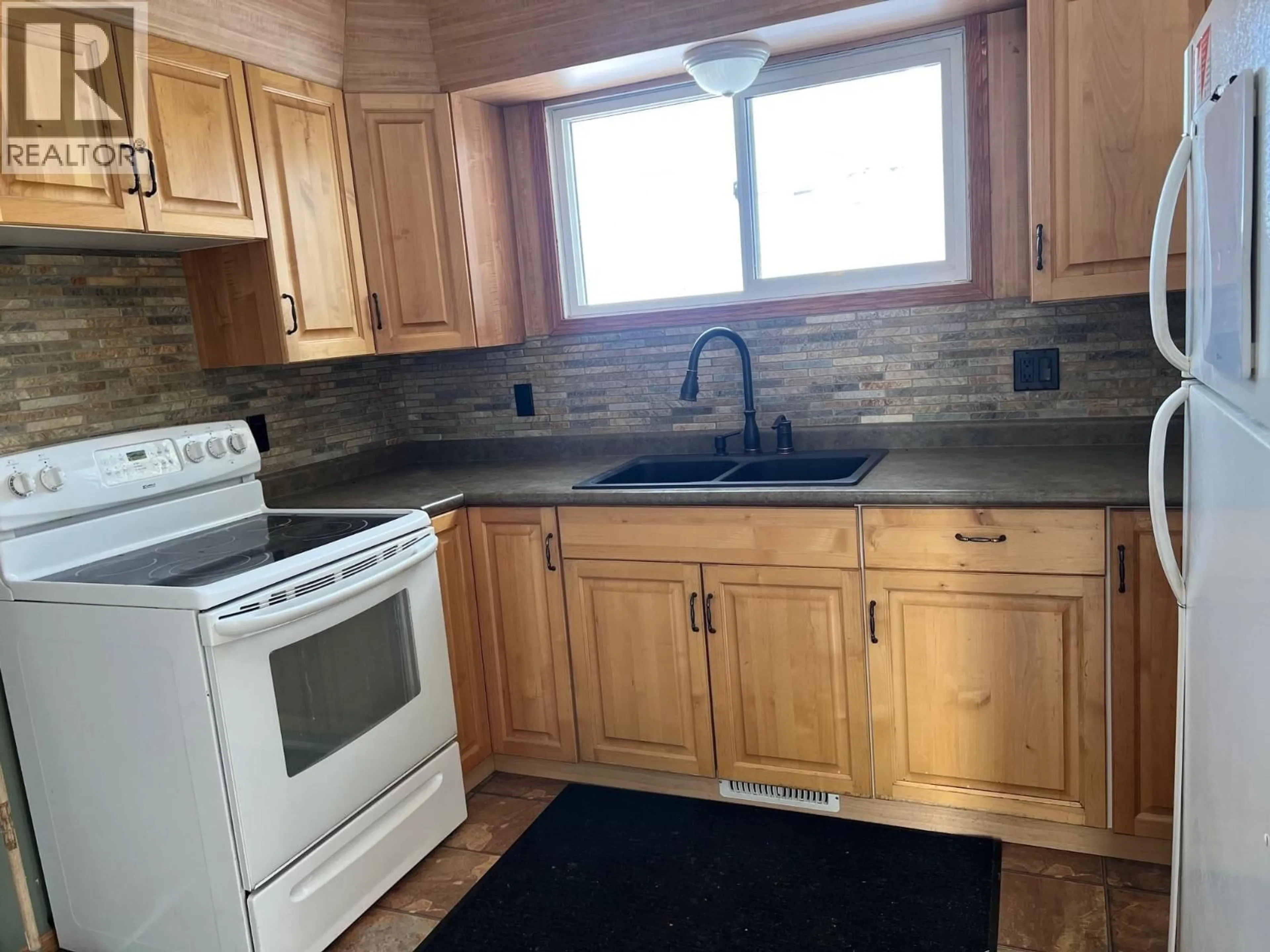 Standard kitchen, wood/laminate floor for 12261 242 ROAD, Fort St. John British Columbia V1J4M7