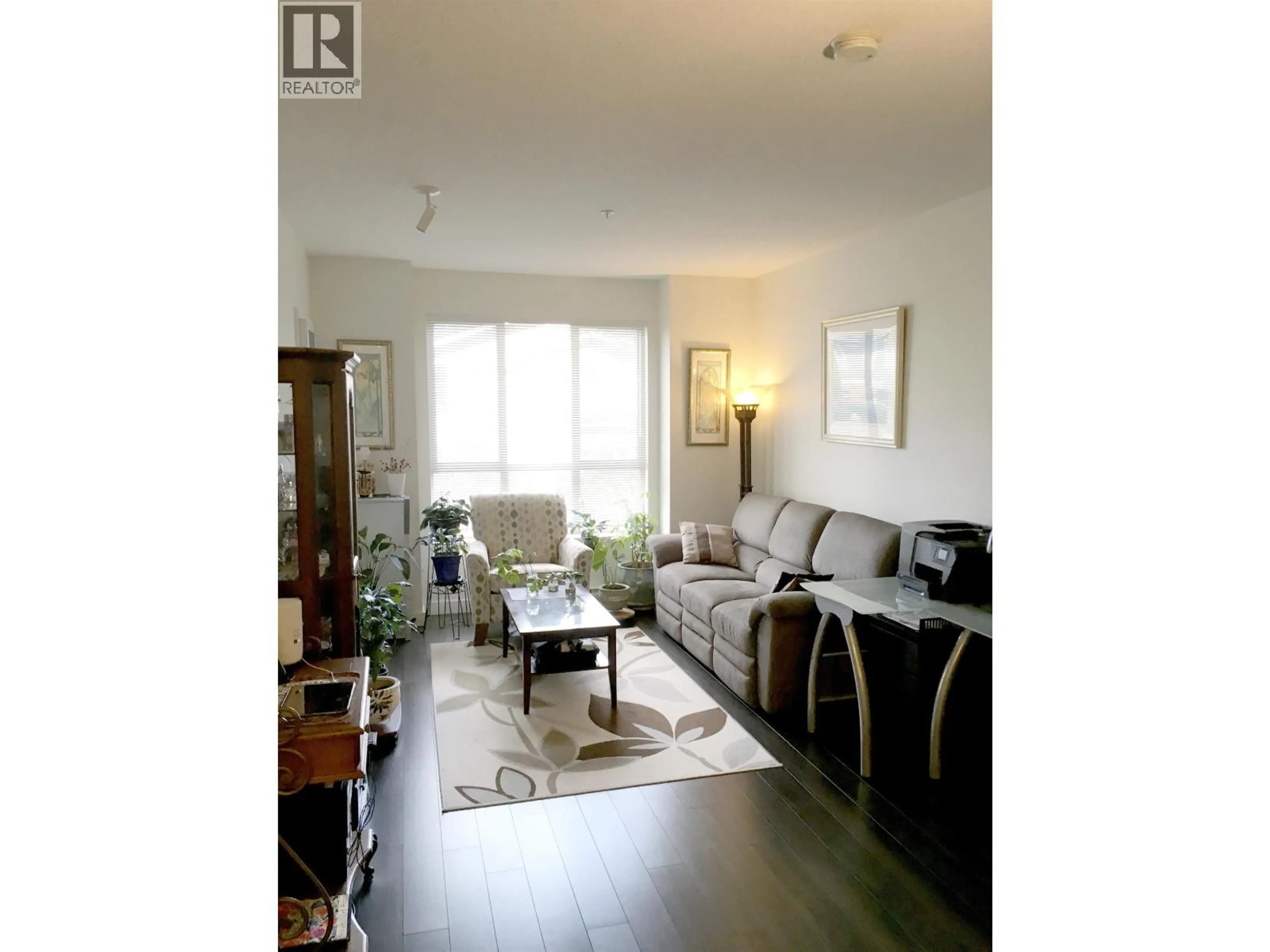 Living room with furniture, wood/laminate floor for 213 - 250 FRANCIS WAY, New Westminster British Columbia V3L0E6