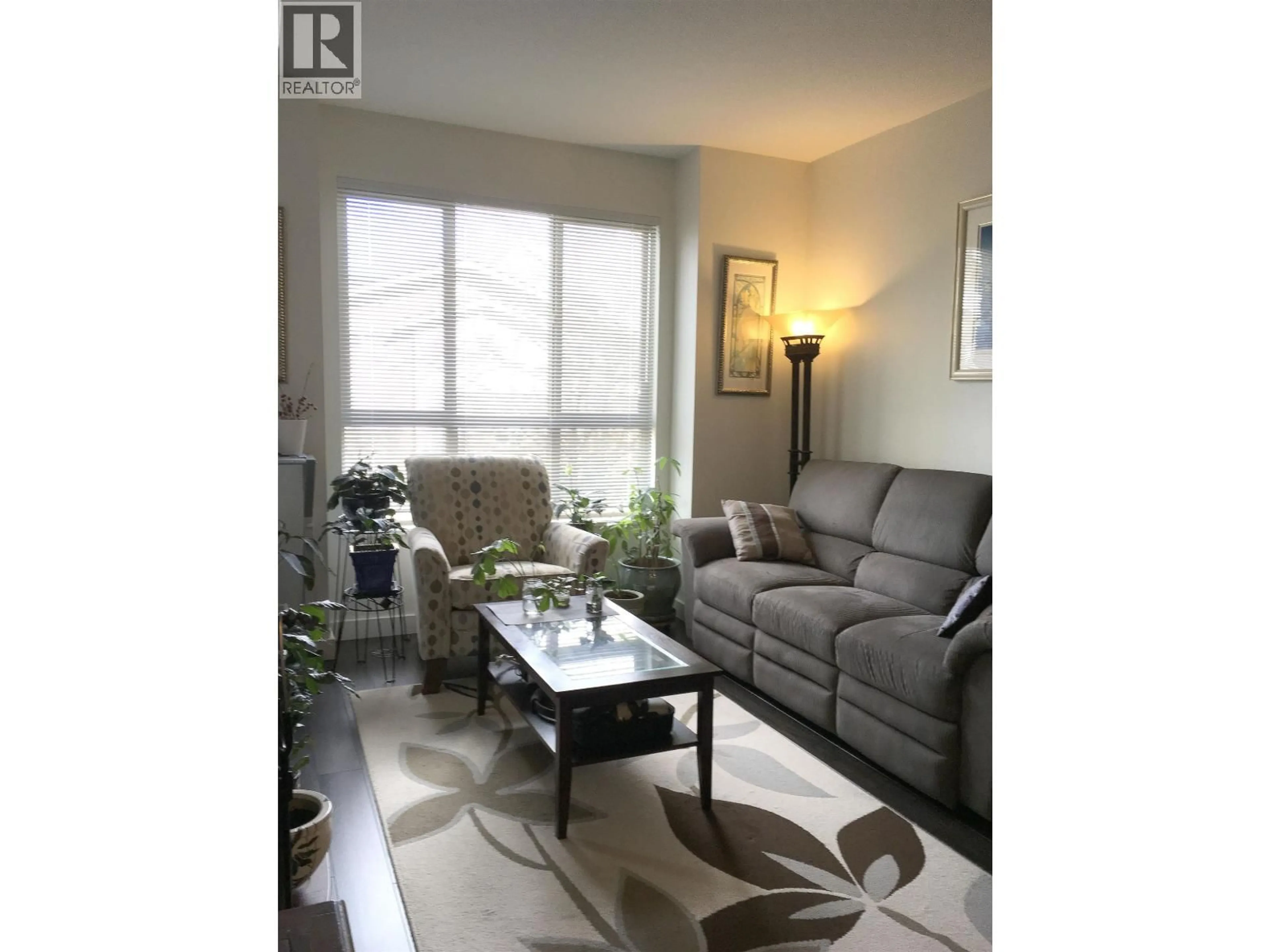 Living room with furniture, wood/laminate floor for 213 - 250 FRANCIS WAY, New Westminster British Columbia V3L0E6