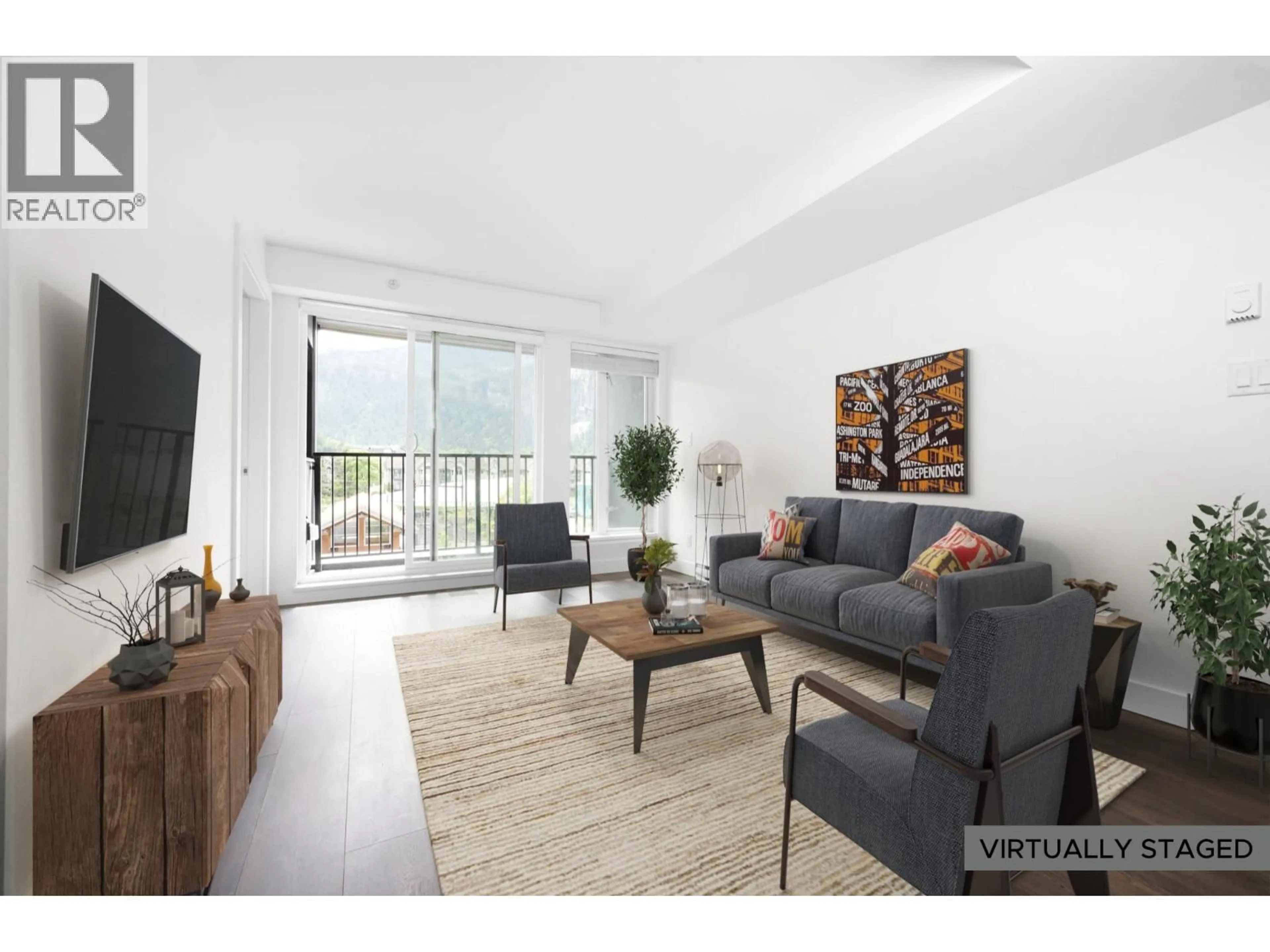 Living room with furniture, wood/laminate floor for 214 - 1365 PEMBERTON AVENUE, Squamish British Columbia V8B1B7