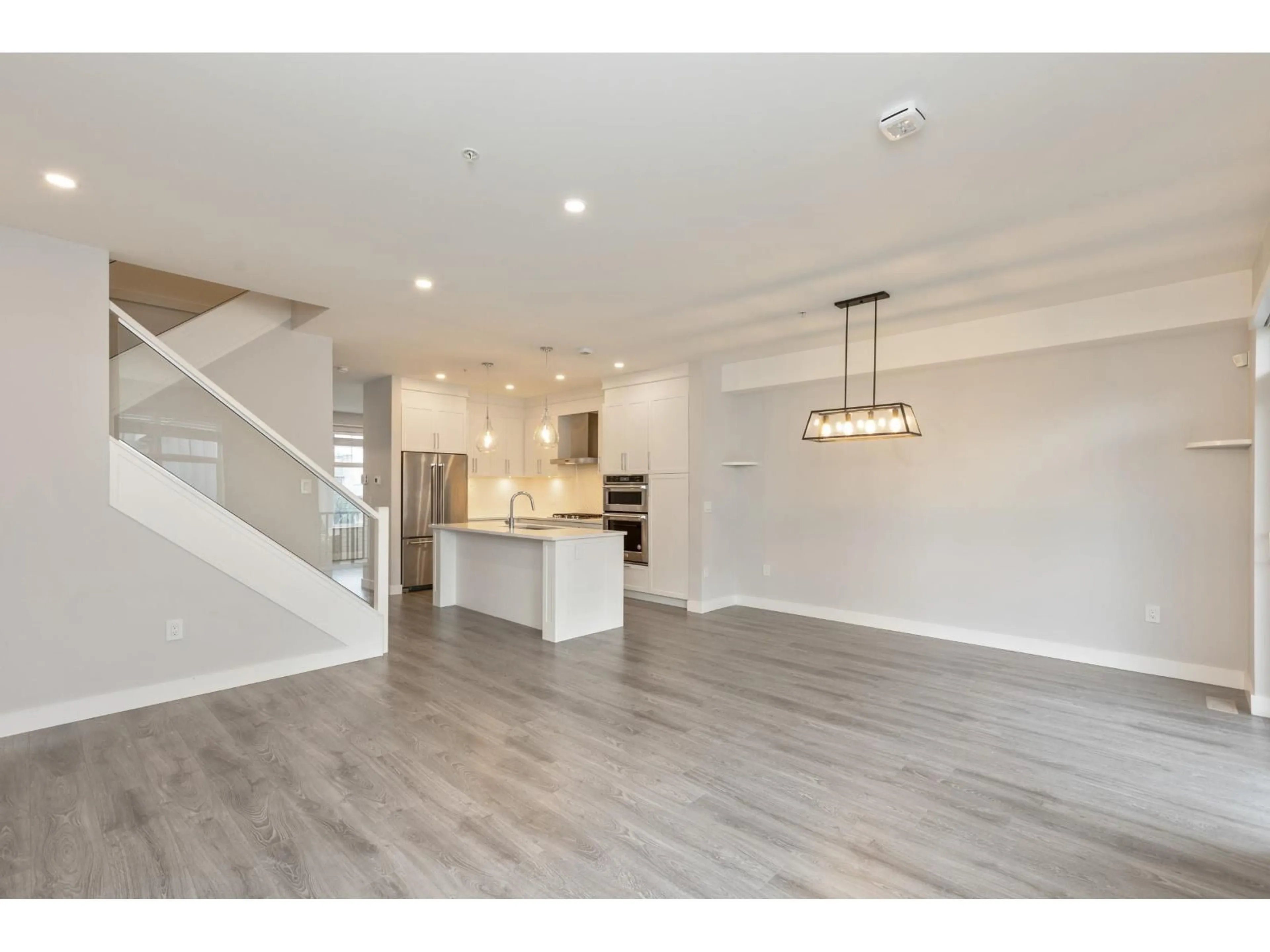 Open concept kitchen, wood/laminate floor for 15 - 20327 72B AVENUE, Langley British Columbia V2Y4J6