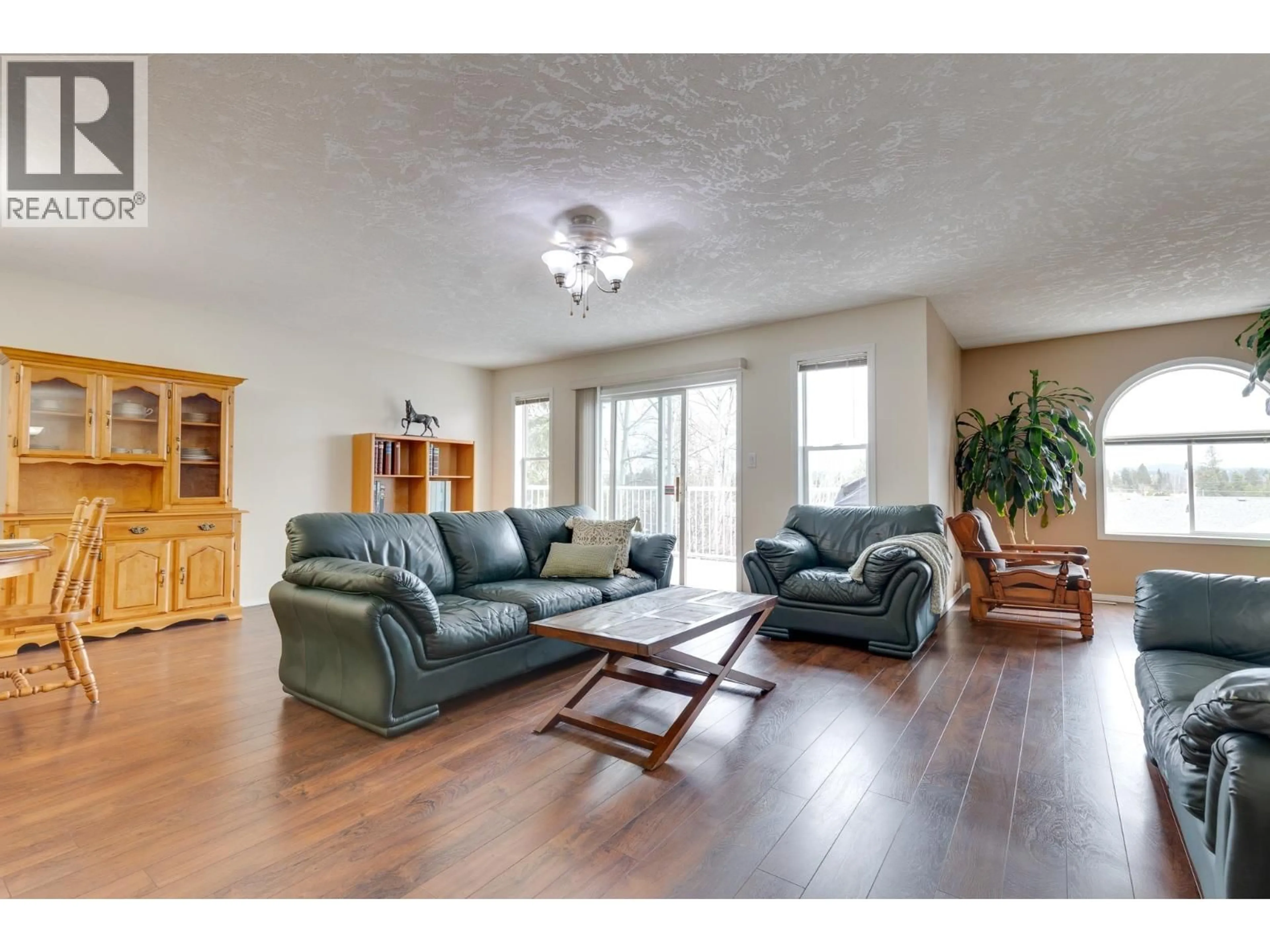 Living room with furniture, wood/laminate floor for 103 - 6855 DOMANAO BOULEVARD, Prince George British Columbia V2N5C9
