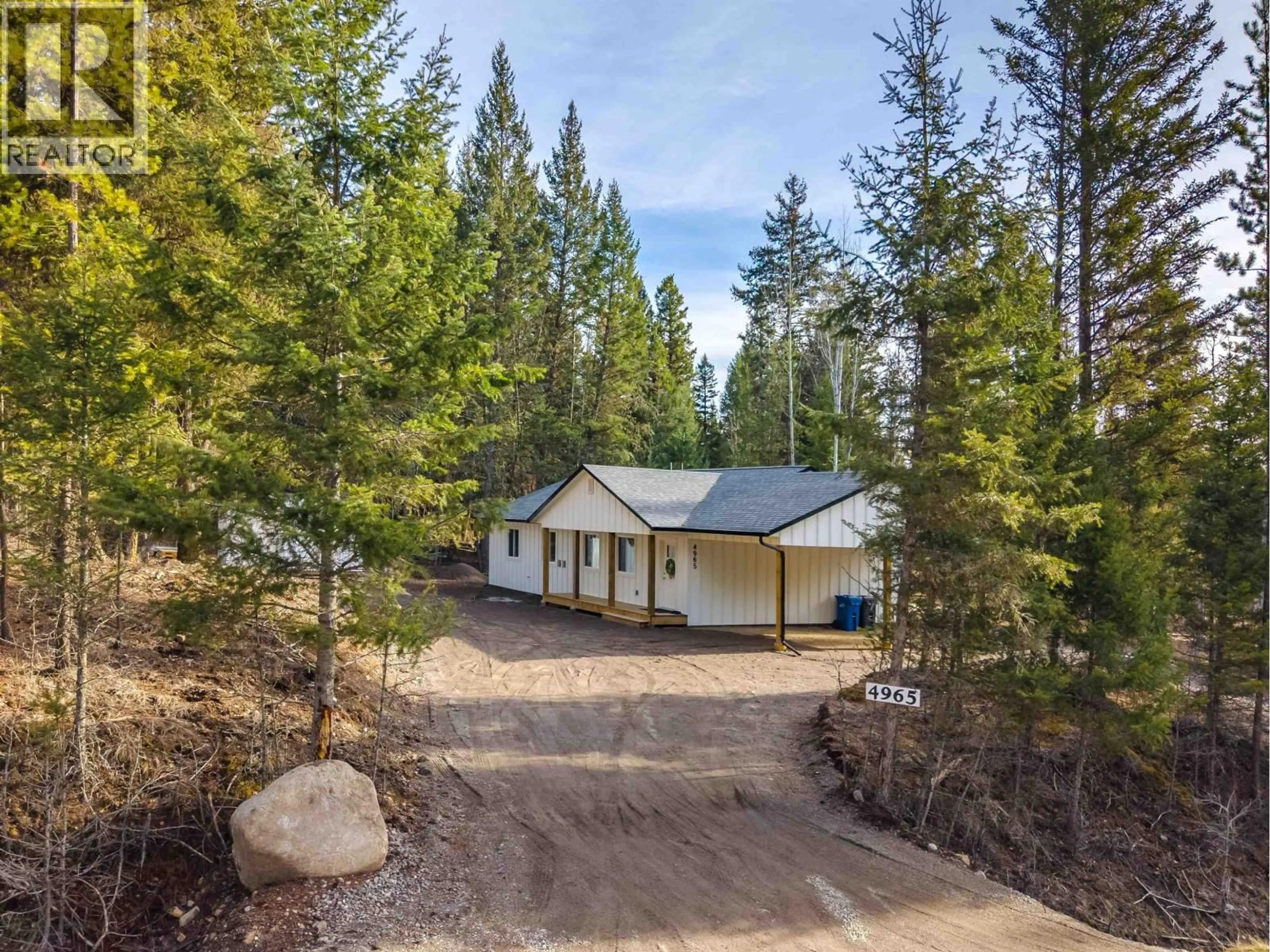 A pic from outside/outdoor area/front of a property/back of a property/a pic from drone, forest/trees view for 4965 BLOCK DRIVE, 108 Mile Ranch British Columbia V0K2Z0