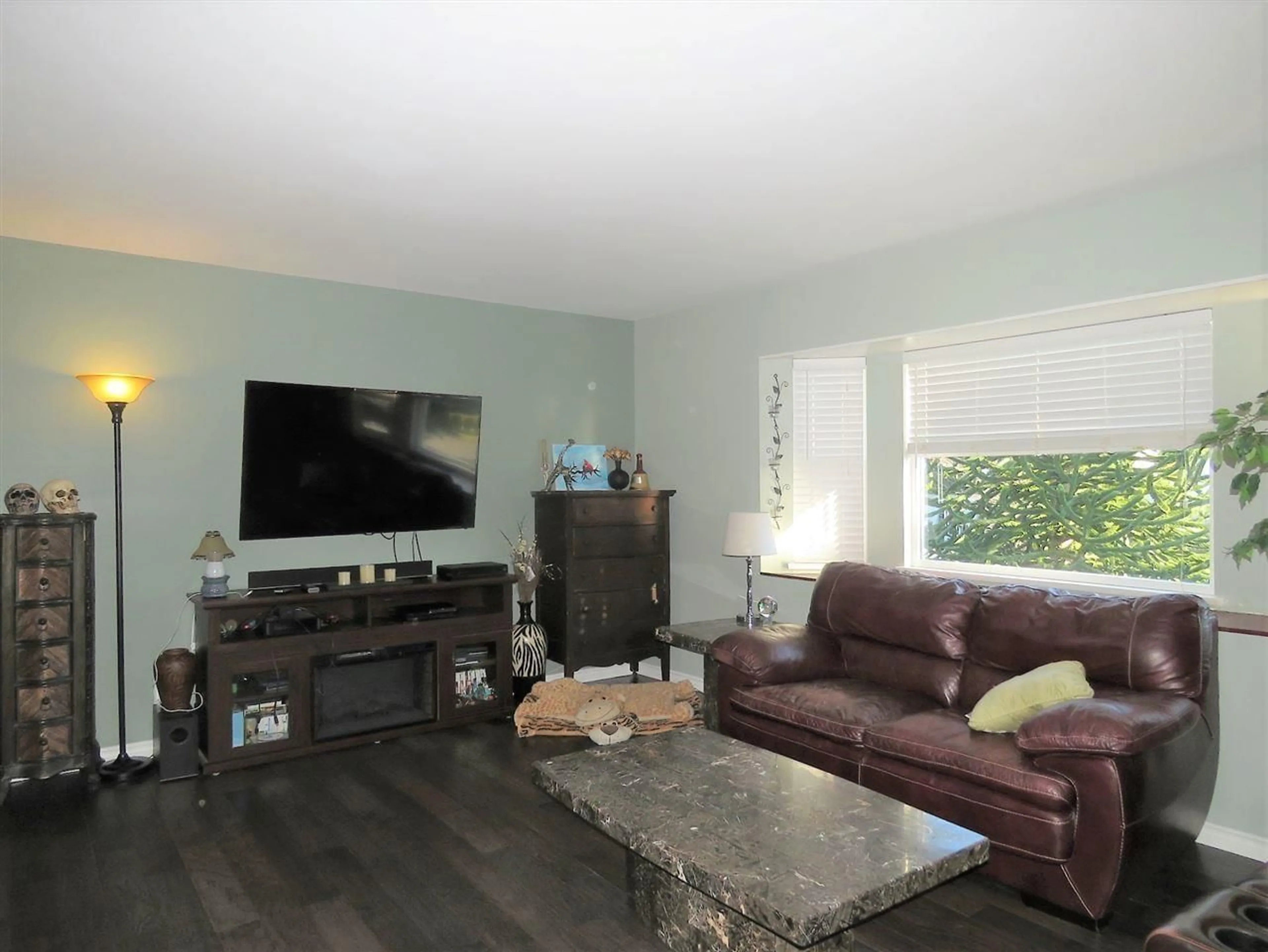 Living room with furniture, wood/laminate floor for 8123 SUMAC PLACE, Mission British Columbia V2V5L2