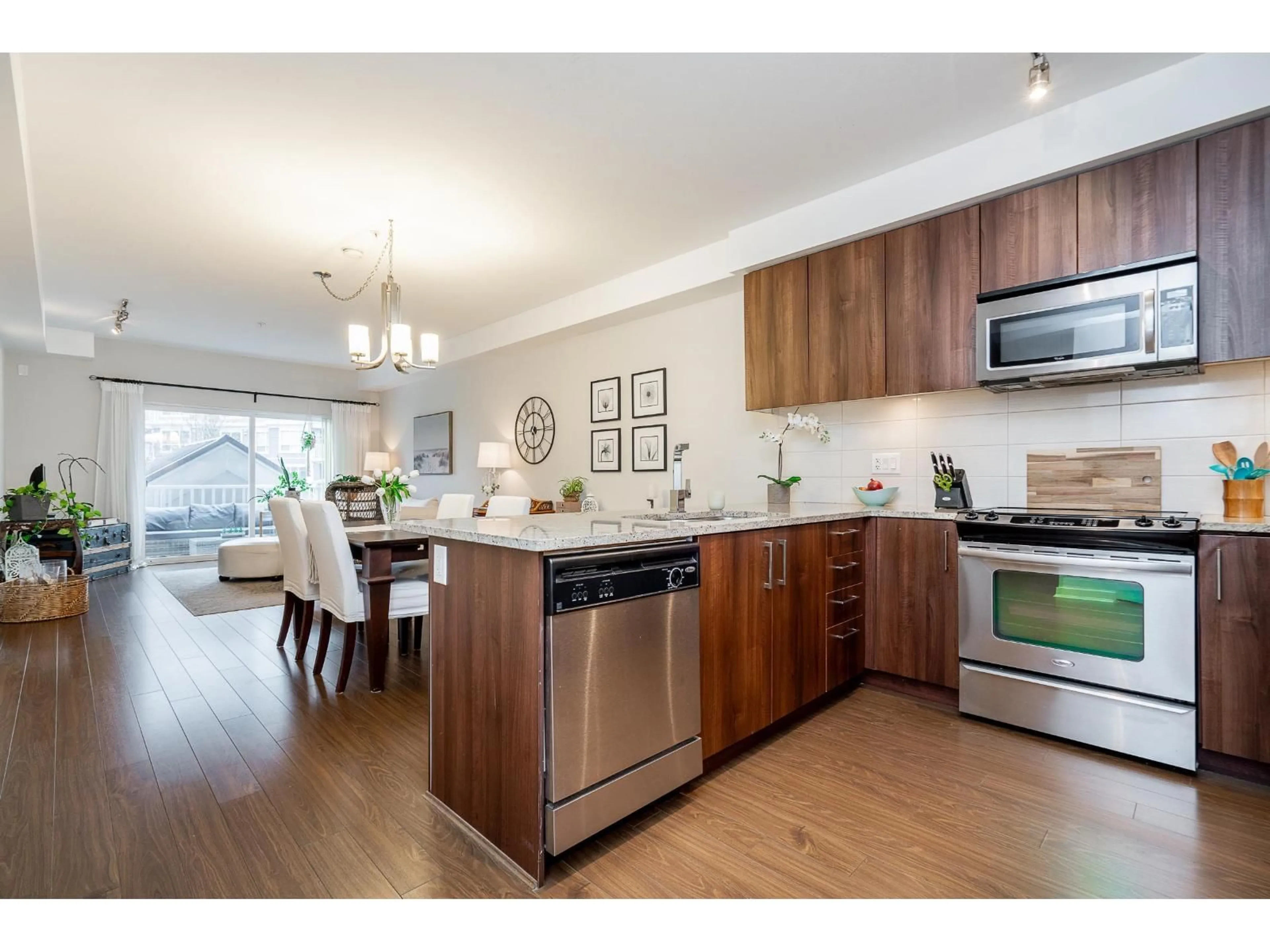 Open concept kitchen, wood/laminate floor for 309 - 6460 194 STREET, Surrey British Columbia V4N6J7