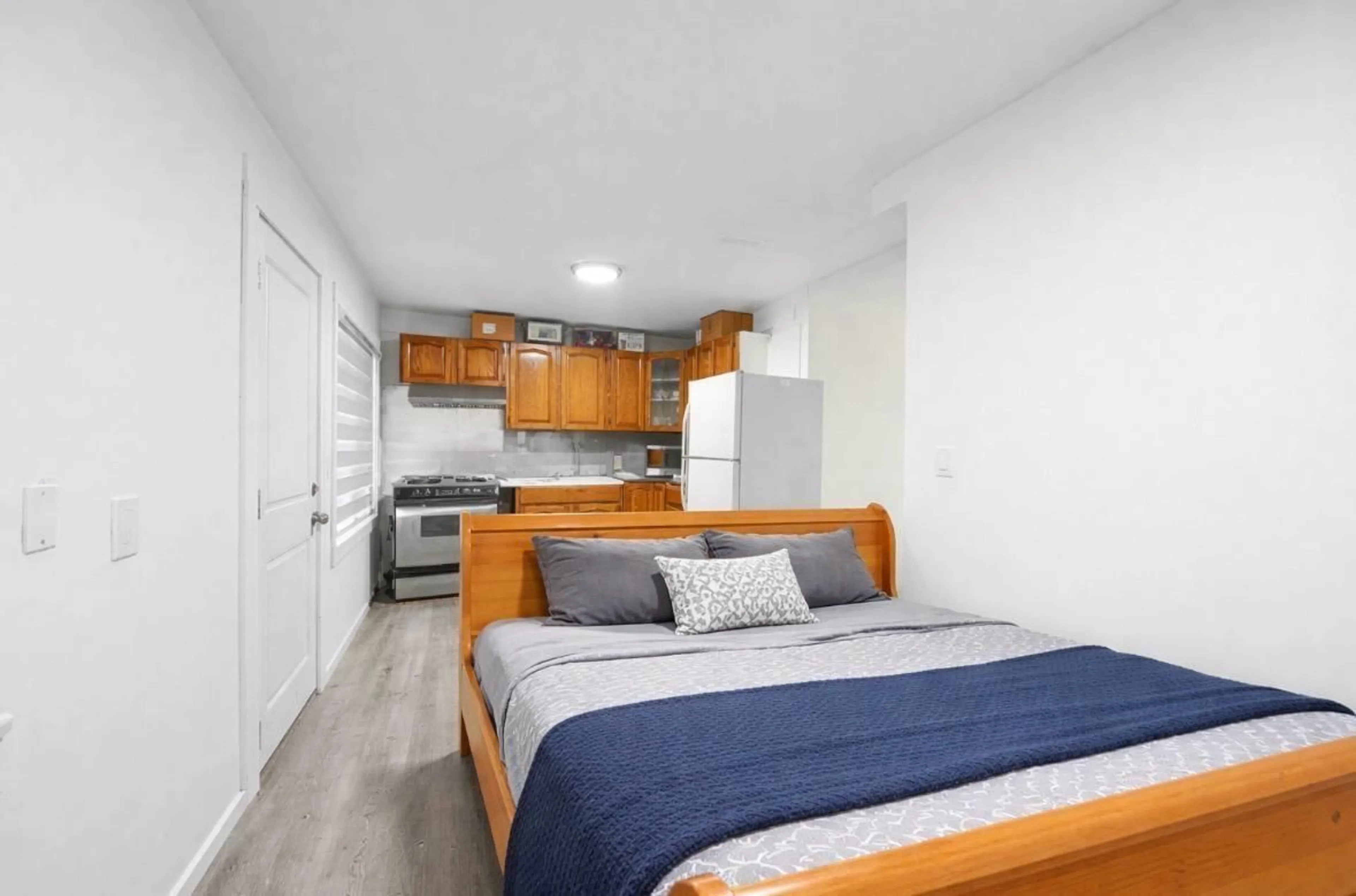 Bedroom with bed, wood/laminate floor for 12729 114A AVENUE, Surrey British Columbia V3V3P3