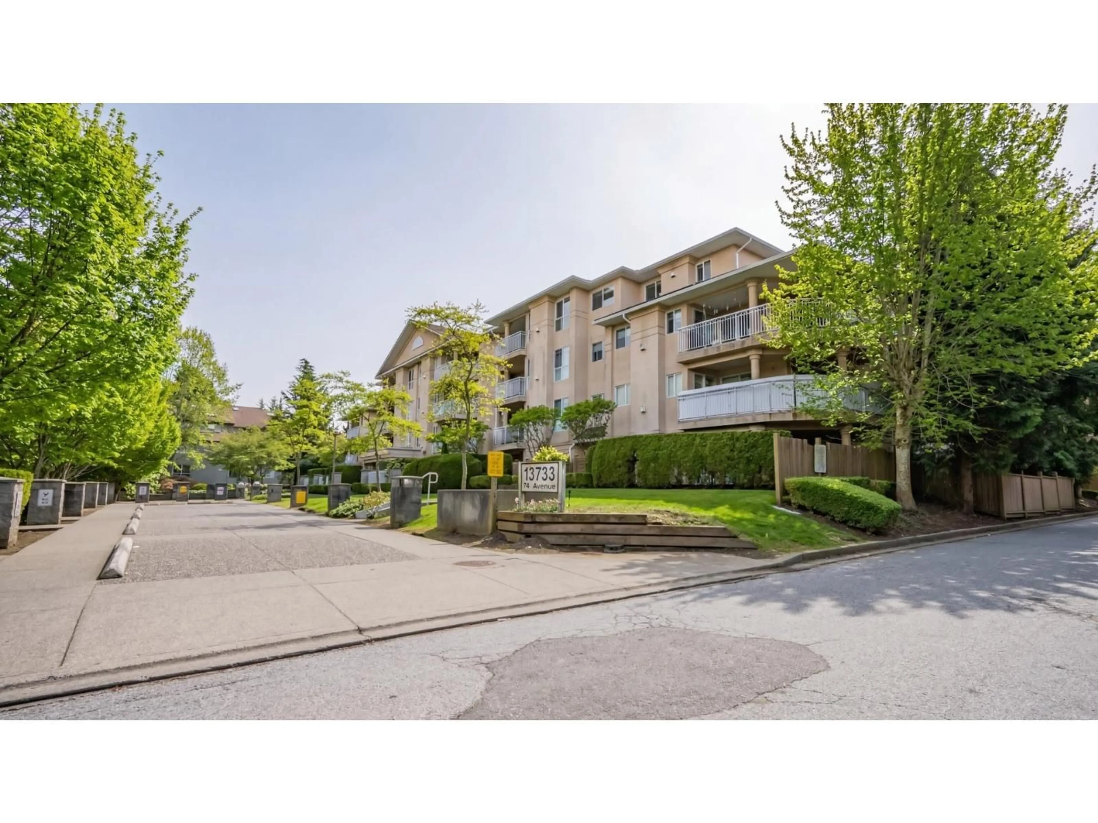 A pic from outside/outdoor area/front of a property/back of a property/a pic from drone, mountain view for 215 - 13733 74 AVENUE, Surrey British Columbia V3W1B8