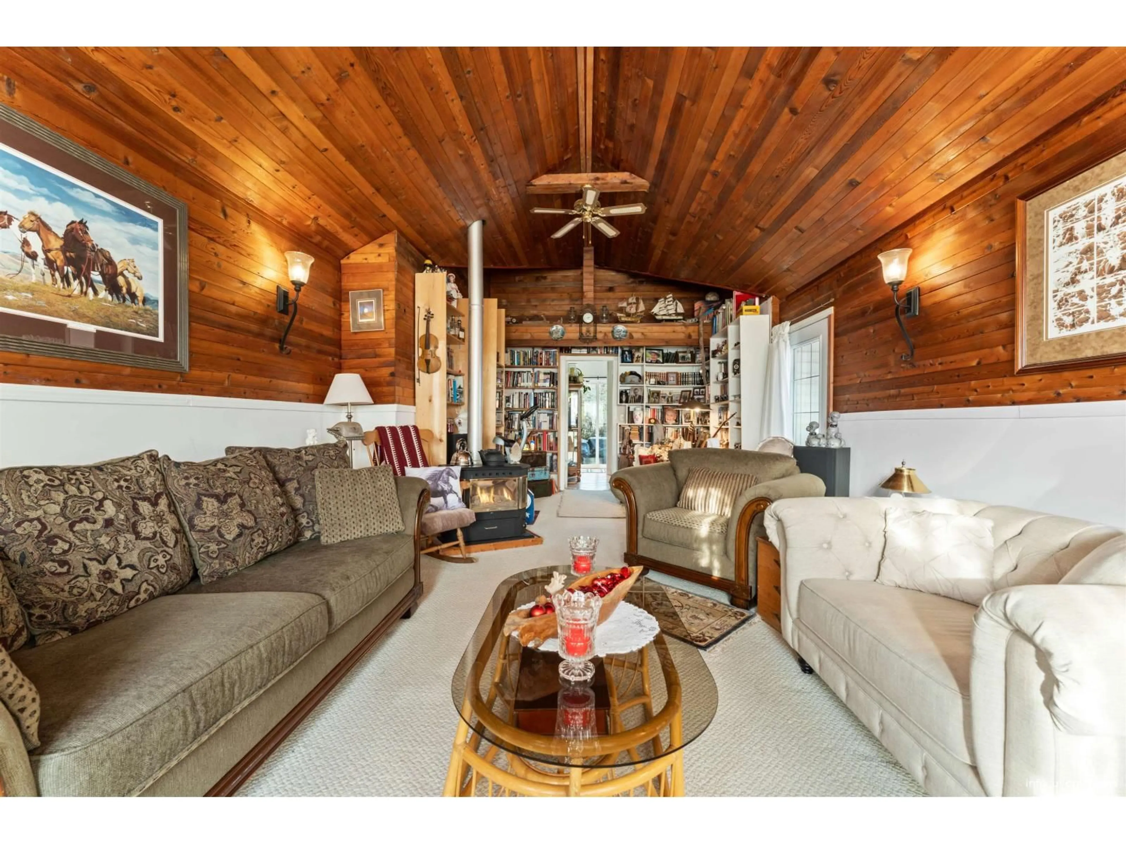 Living room with furniture, wood/laminate floor for 17307 58 AVENUE, Surrey British Columbia V3S1K7