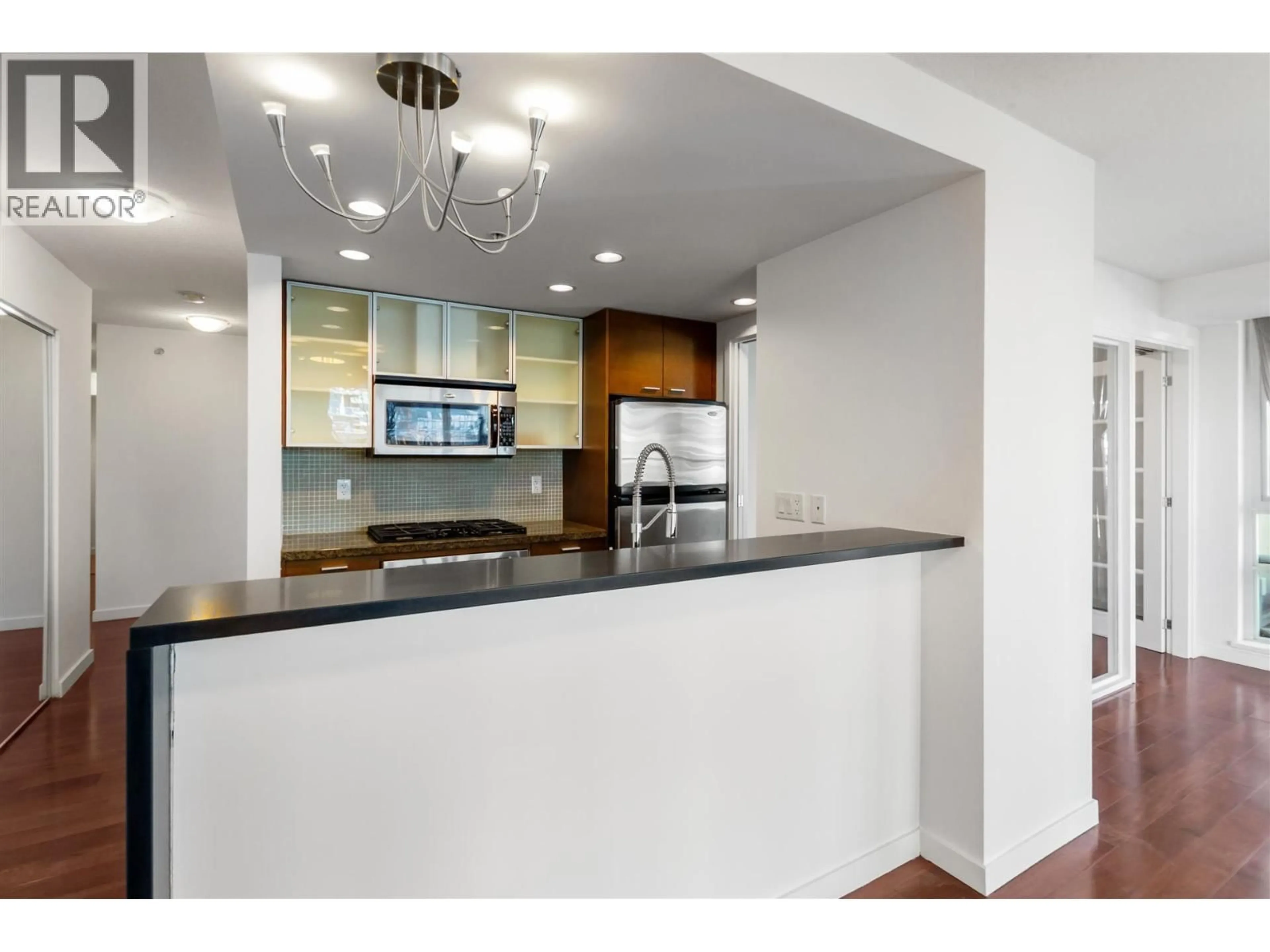 Open concept kitchen, ceramic/tile floor for 306 - 980 COOPERAGE WAY, Vancouver British Columbia V6B0C3