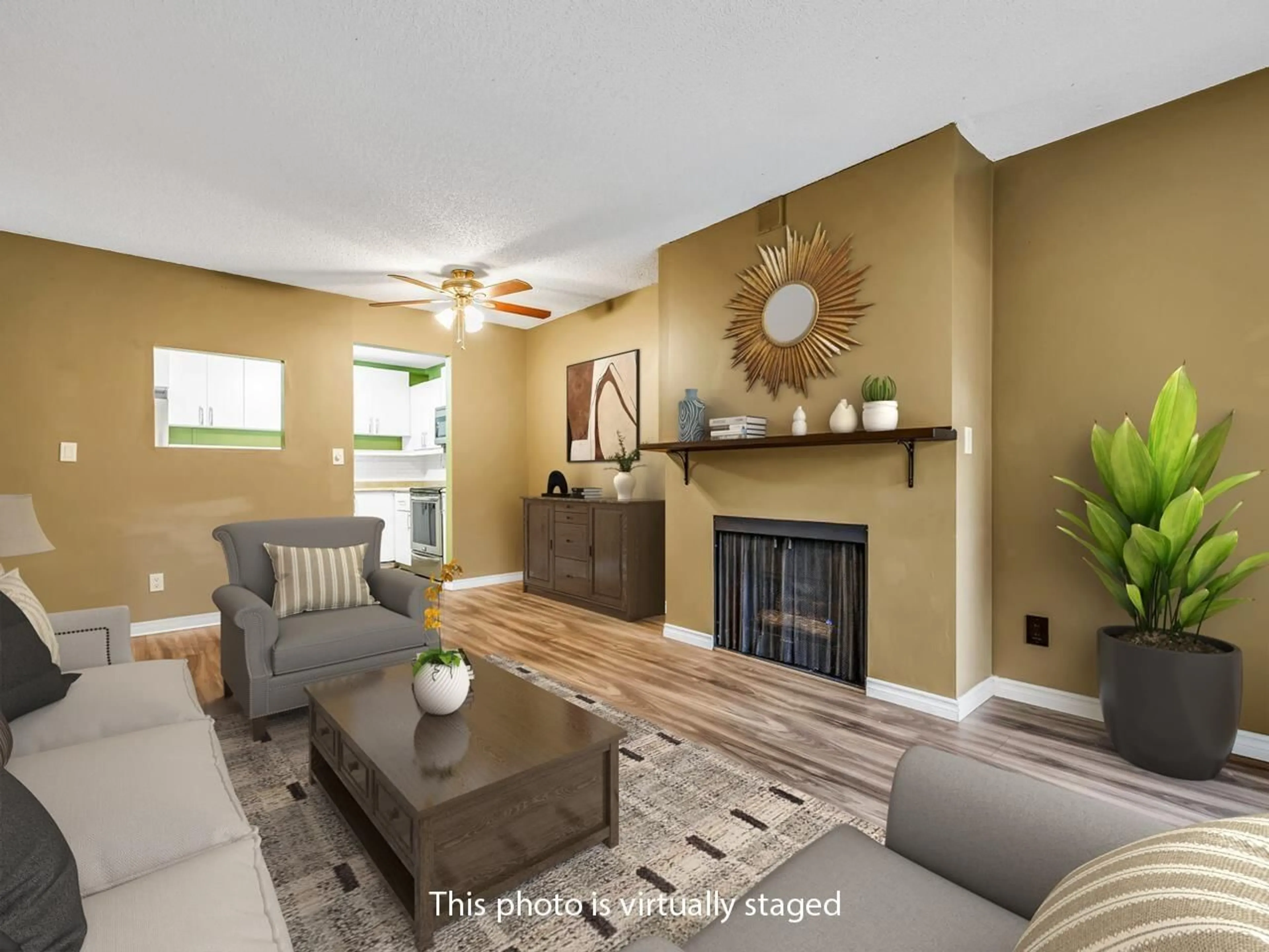 Living room with furniture, wood/laminate floor for 211 - 10157 UNIVERSITY DRIVE, Surrey British Columbia V3T5L7