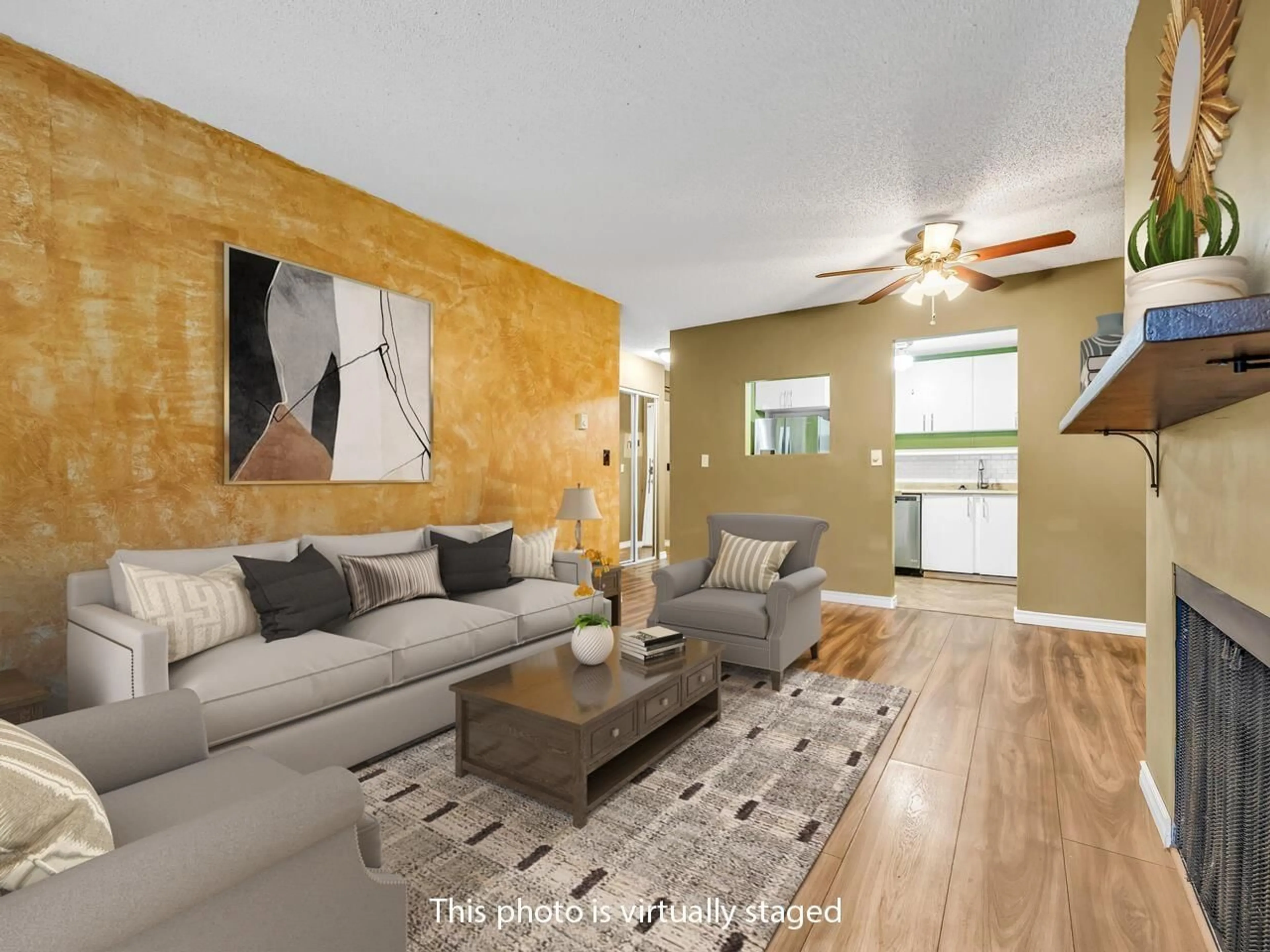 Living room with furniture, wood/laminate floor for 211 - 10157 UNIVERSITY DRIVE, Surrey British Columbia V3T5L7