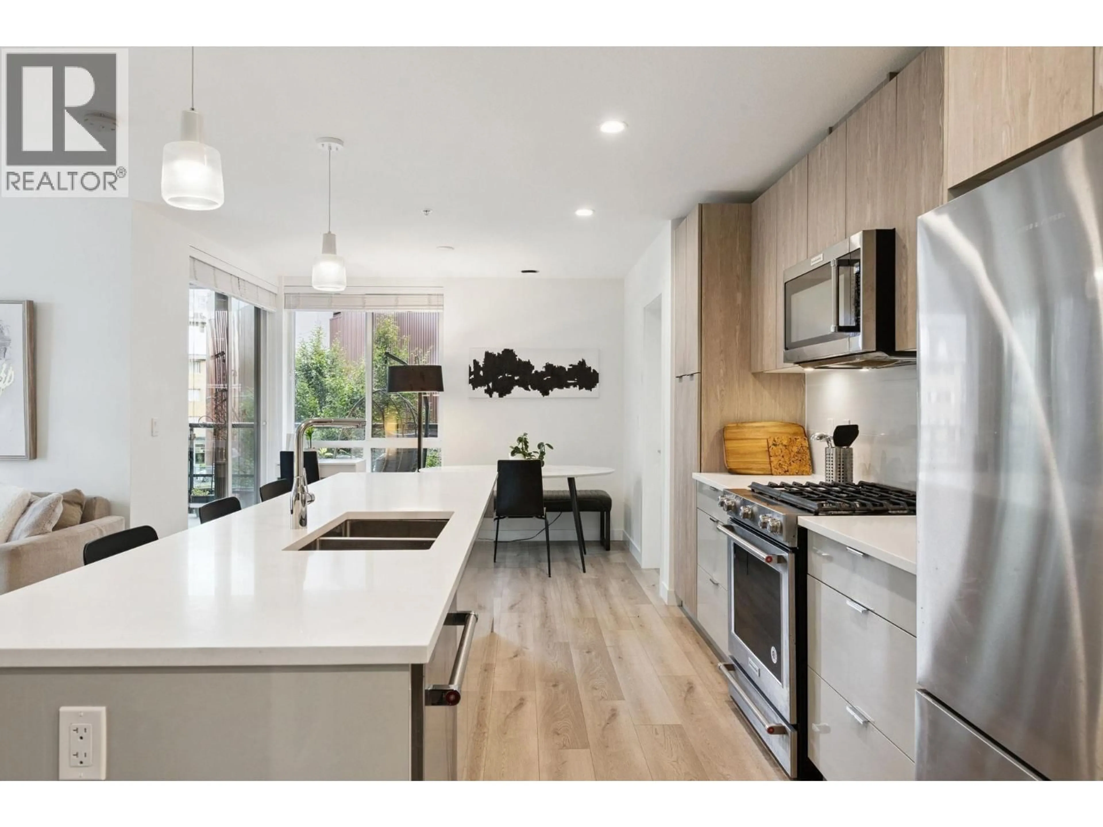 Open concept kitchen, unknown for 309 - 128 8TH STREET, North Vancouver British Columbia V7L0H2