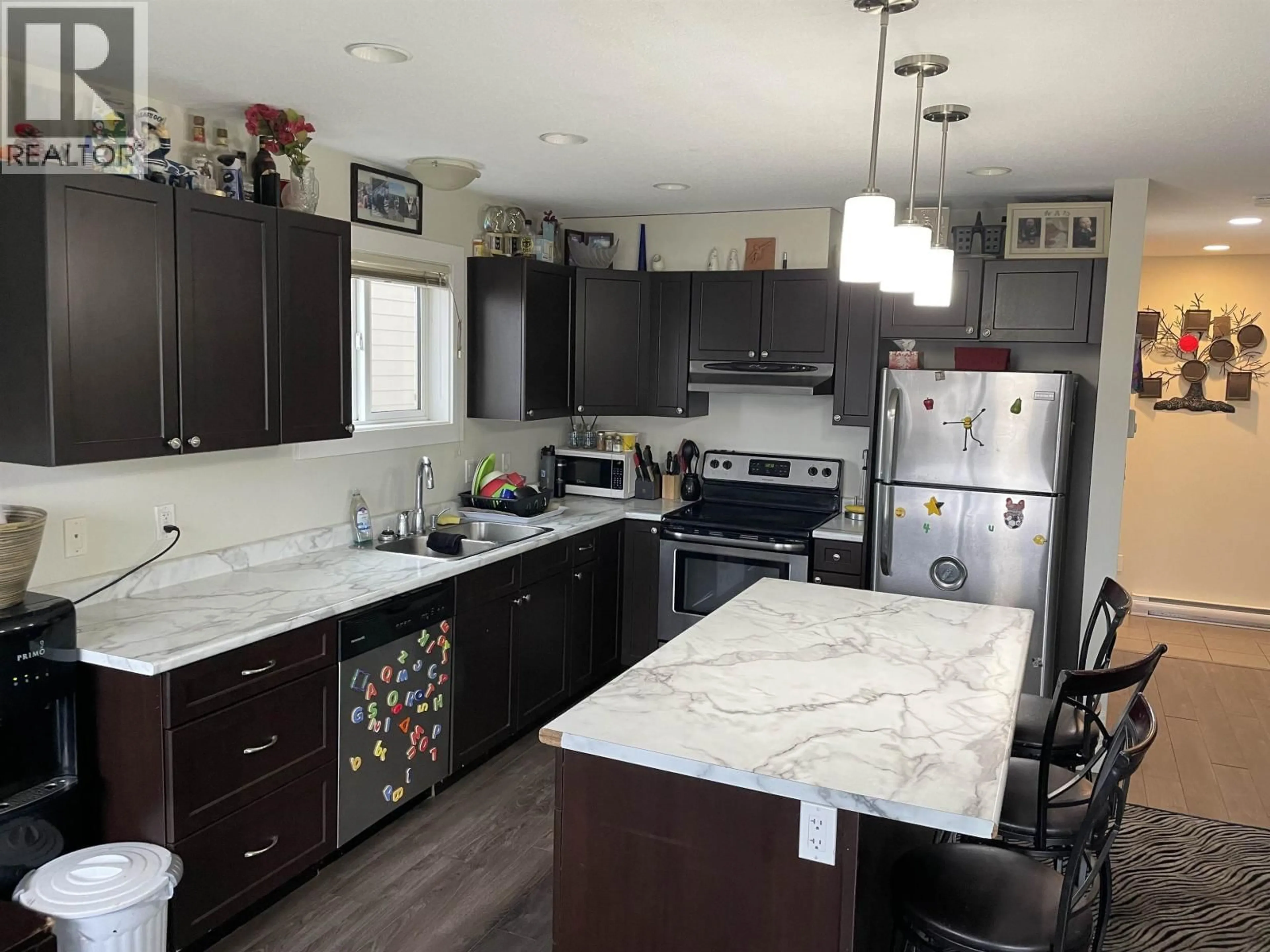 Open concept kitchen, ceramic/tile floor for 11112 104A AVENUE, Fort St. John British Columbia V1J0J3