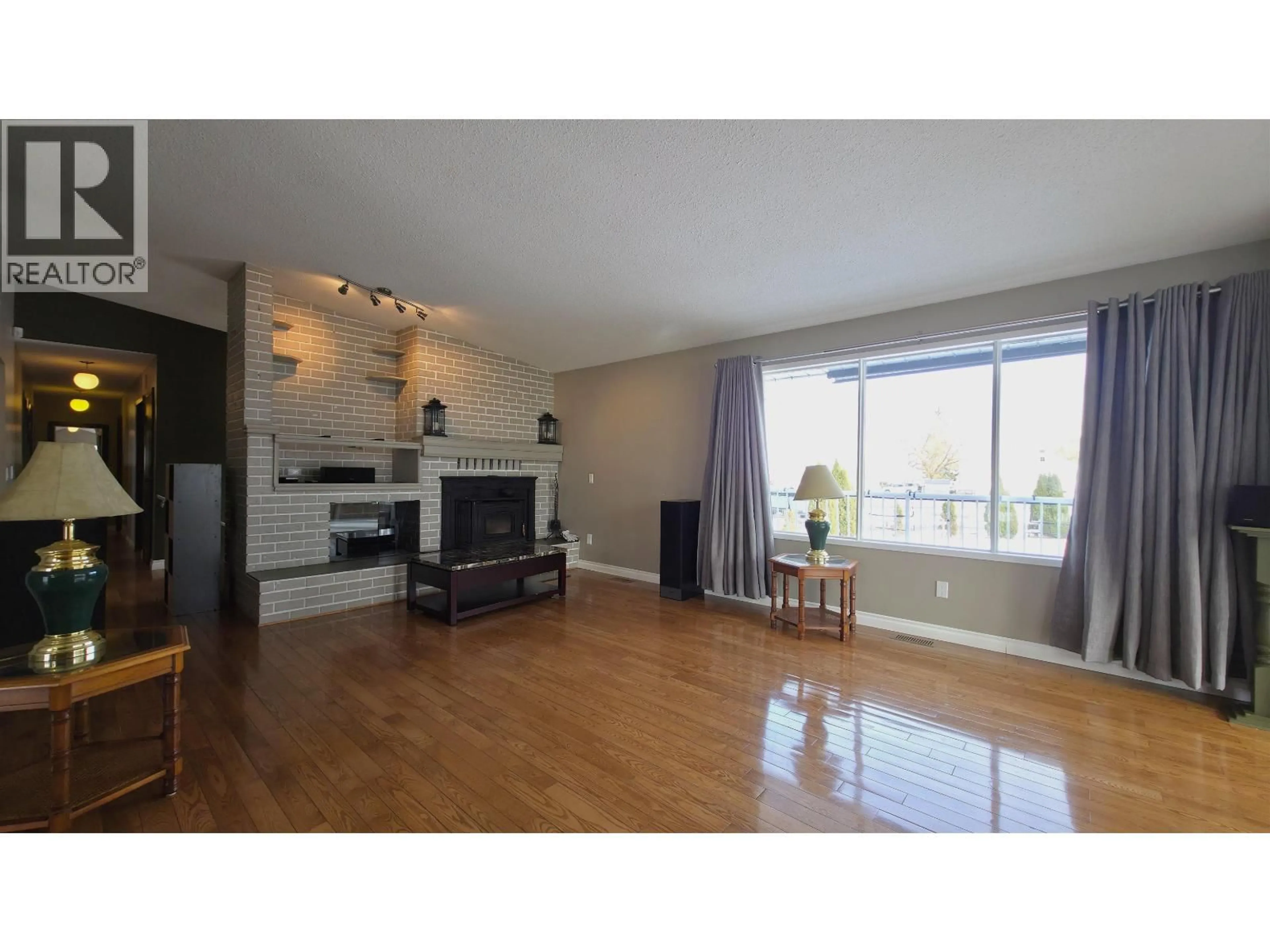 Living room with furniture, wood/laminate floor for 16795 HART HIGHWAY, Prince George British Columbia V2K5X5