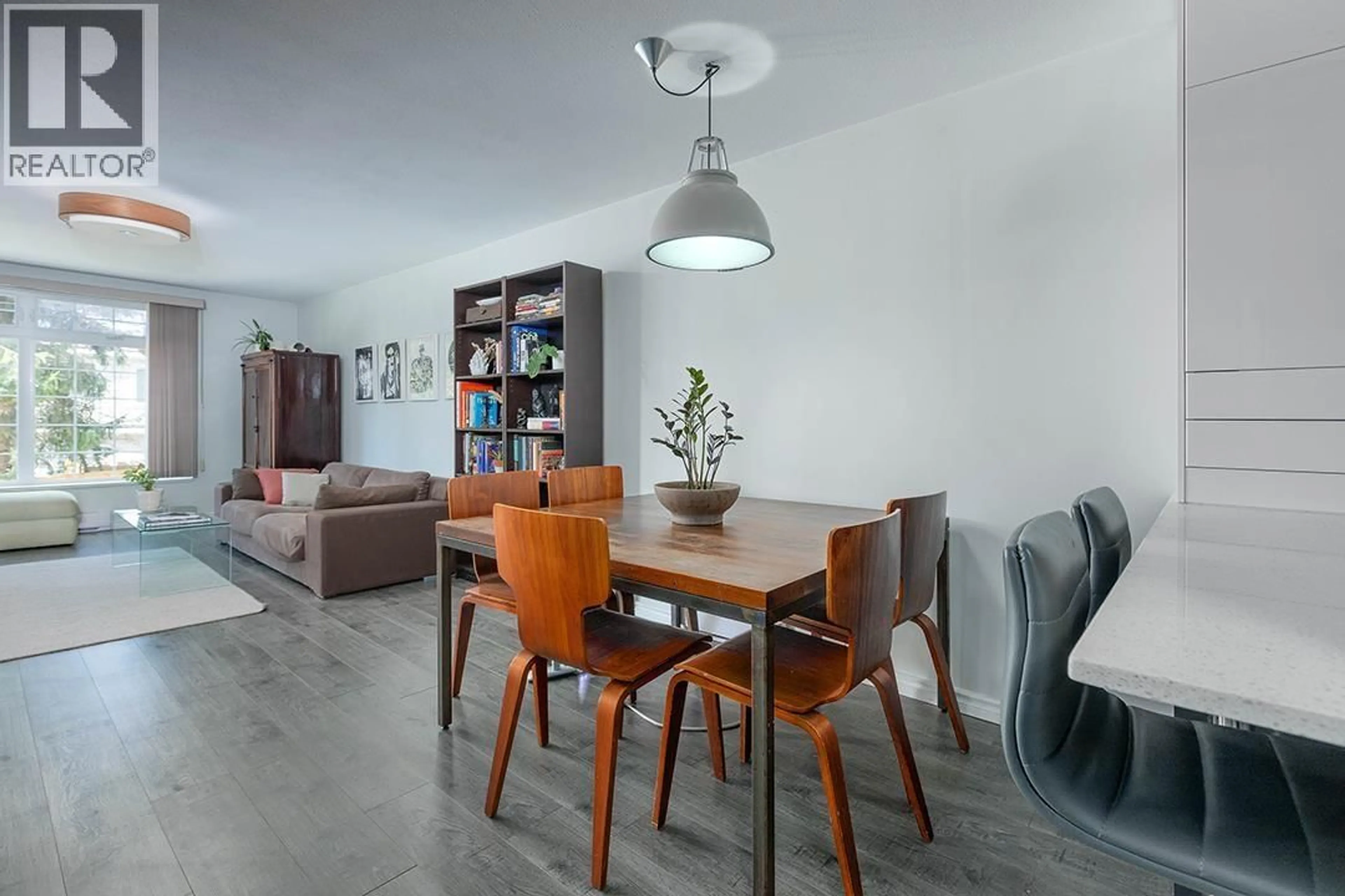 Dining room, wood/laminate floor for 102 - 3981 FRASER STREET, Vancouver British Columbia V5V4E5