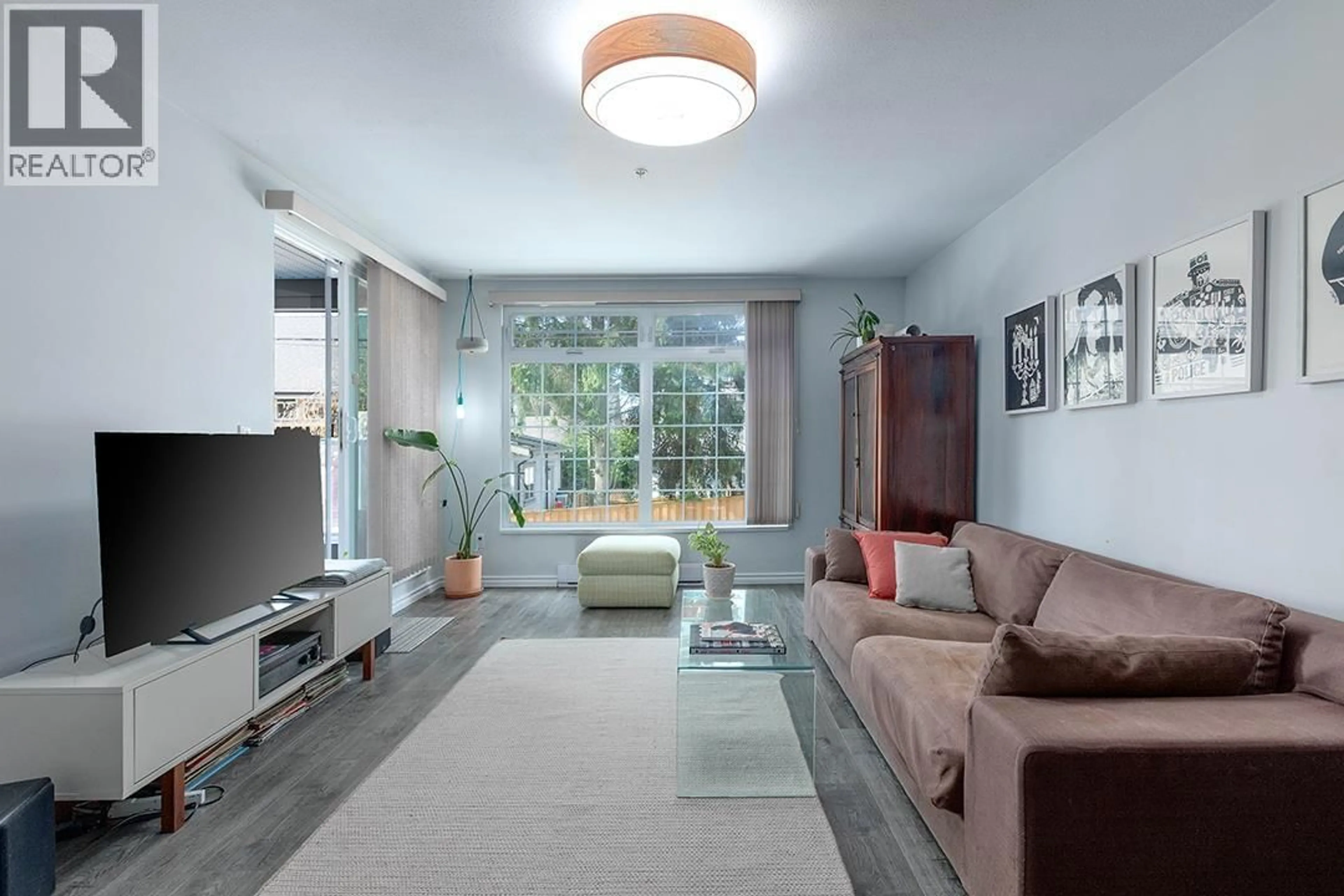 Living room with furniture, unknown for 102 - 3981 FRASER STREET, Vancouver British Columbia V5V4E5