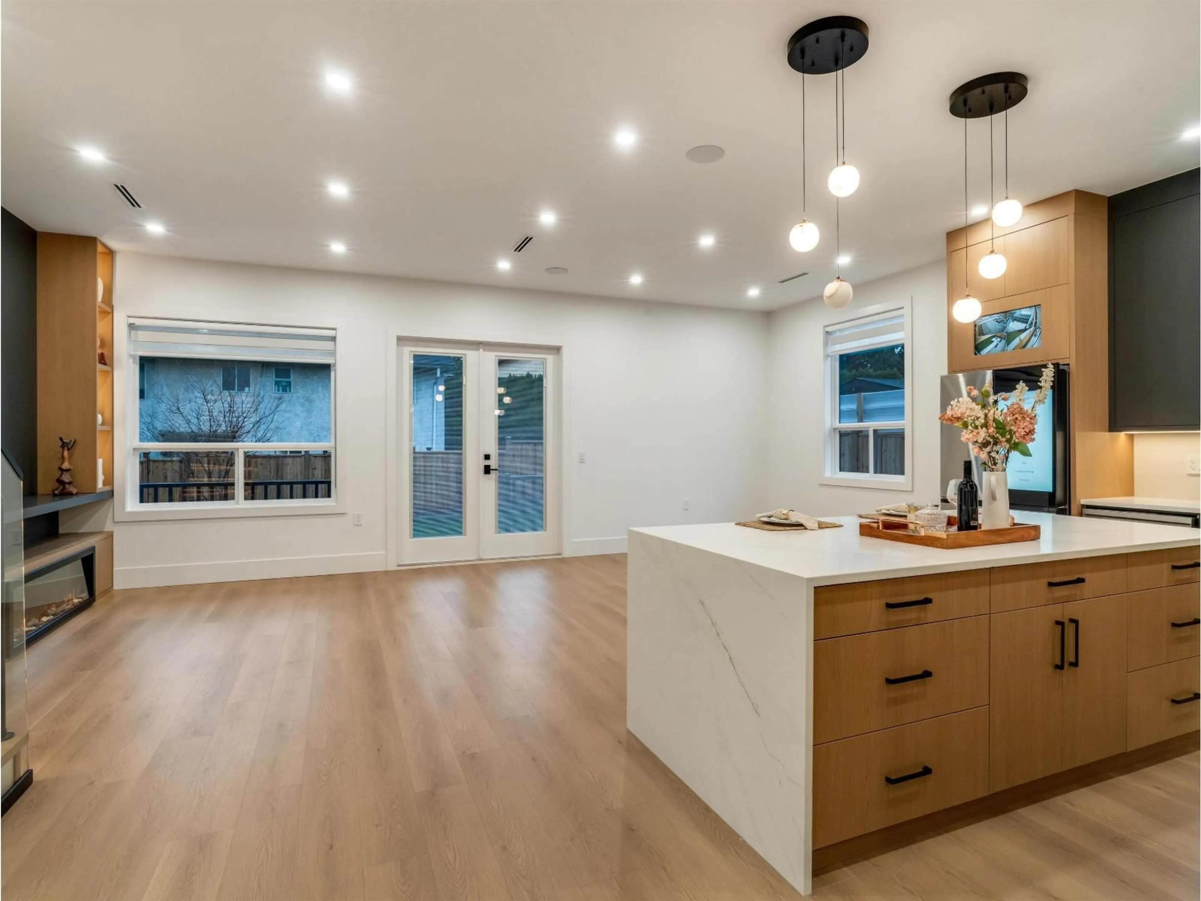 Open concept kitchen, wood/laminate floor for 11768 92 AVENUE, Delta British Columbia V4C3L4