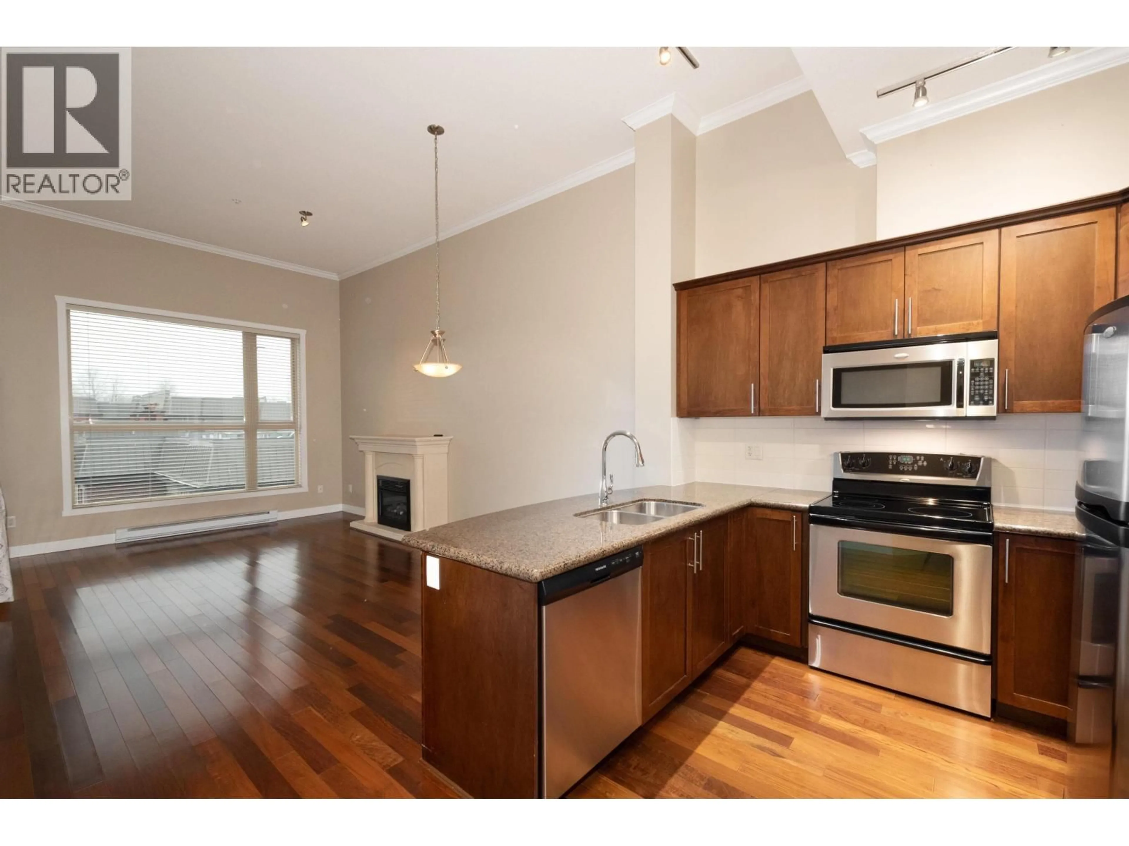 Open concept kitchen, wood/laminate floor for 412 - 2627 SHAUGHNESSY STREET, Port Coquitlam British Columbia V3C0E1