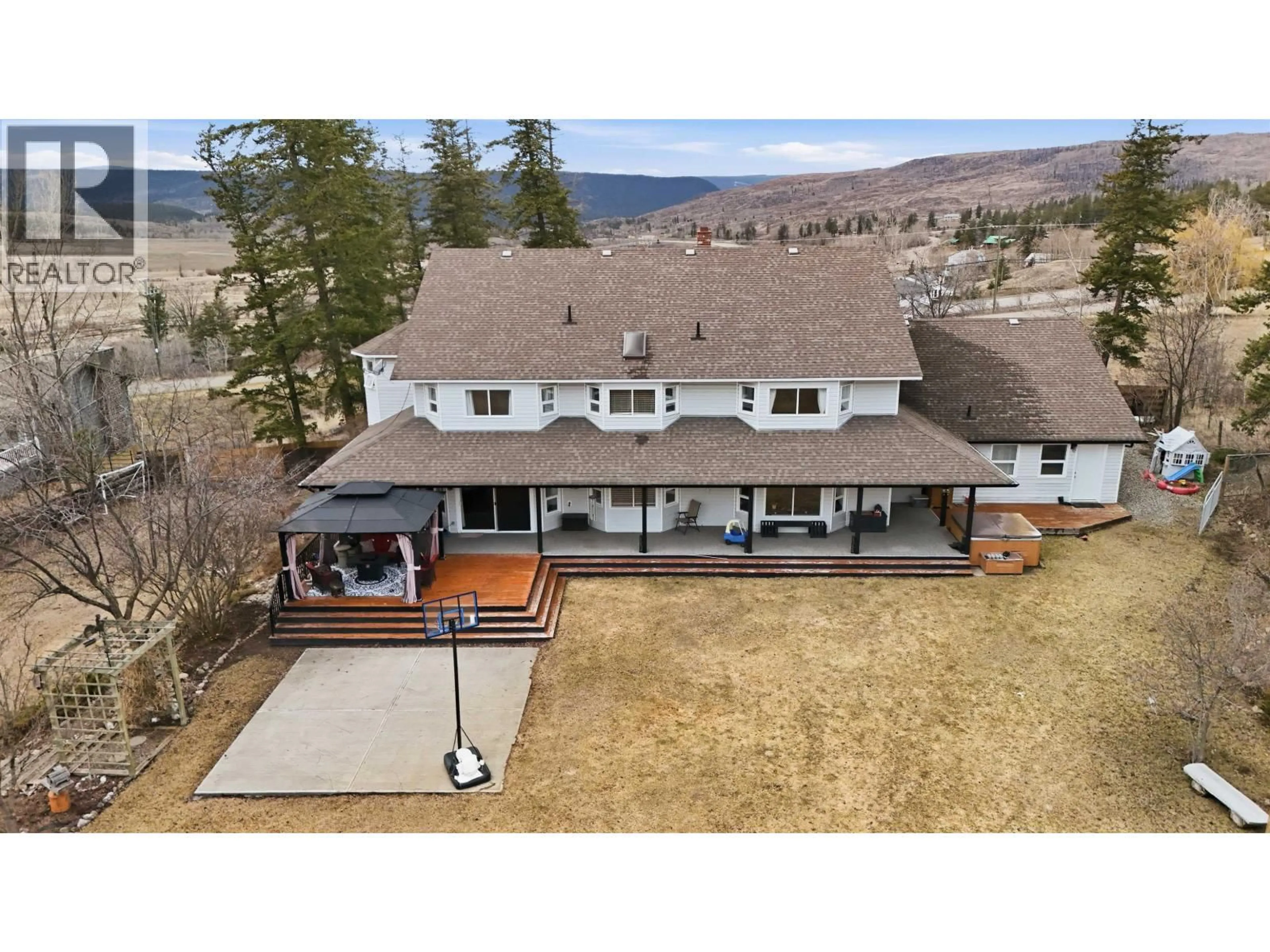 A pic from outside/outdoor area/front of a property/back of a property/a pic from drone, mountain view for 48 VALLEYVIEW ROAD, 150 Mile House British Columbia V0K2G0