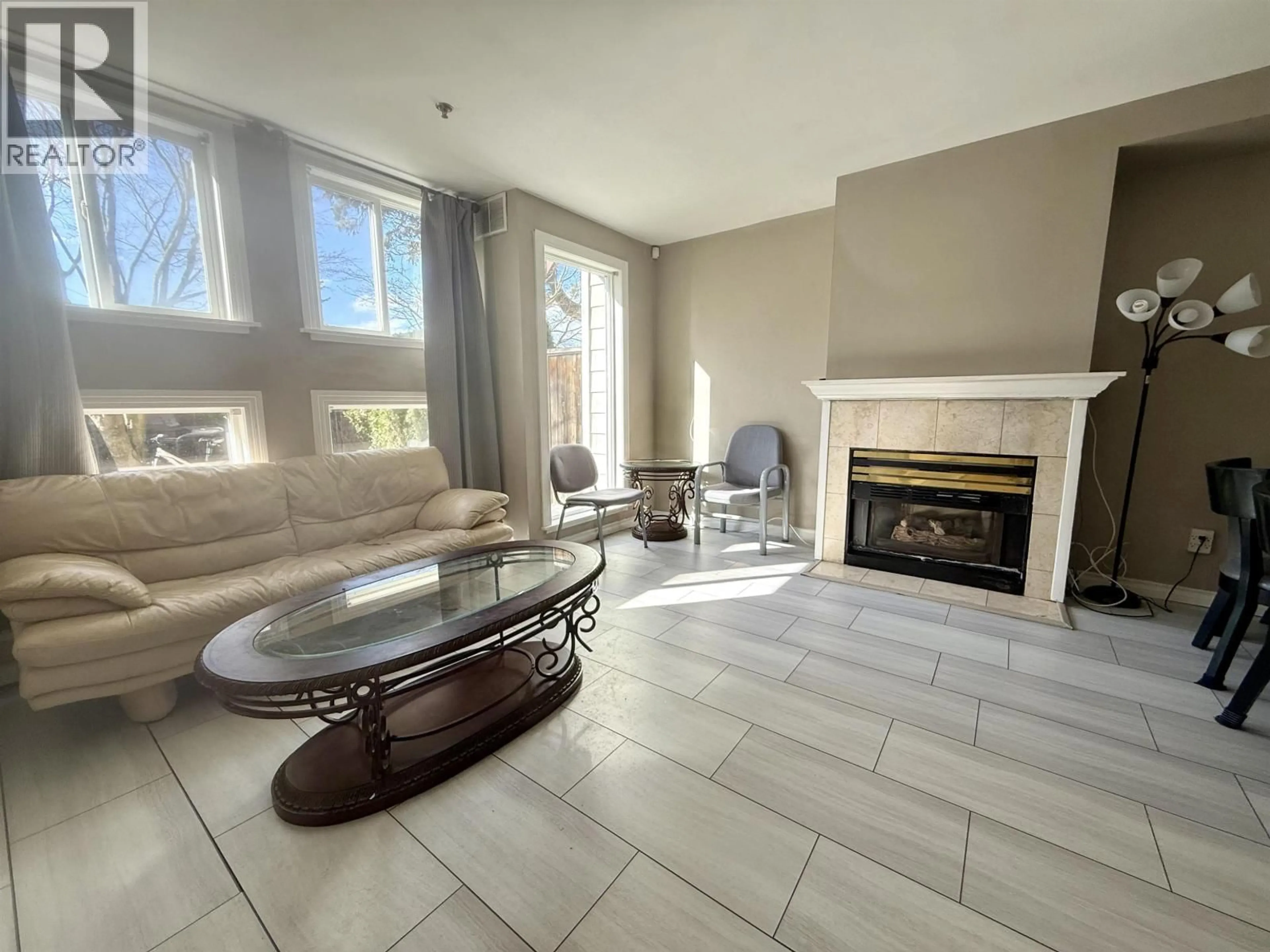 Living room with furniture, unknown for 105 - 7288 NO. 3 ROAD, Richmond British Columbia V6Y3Y1