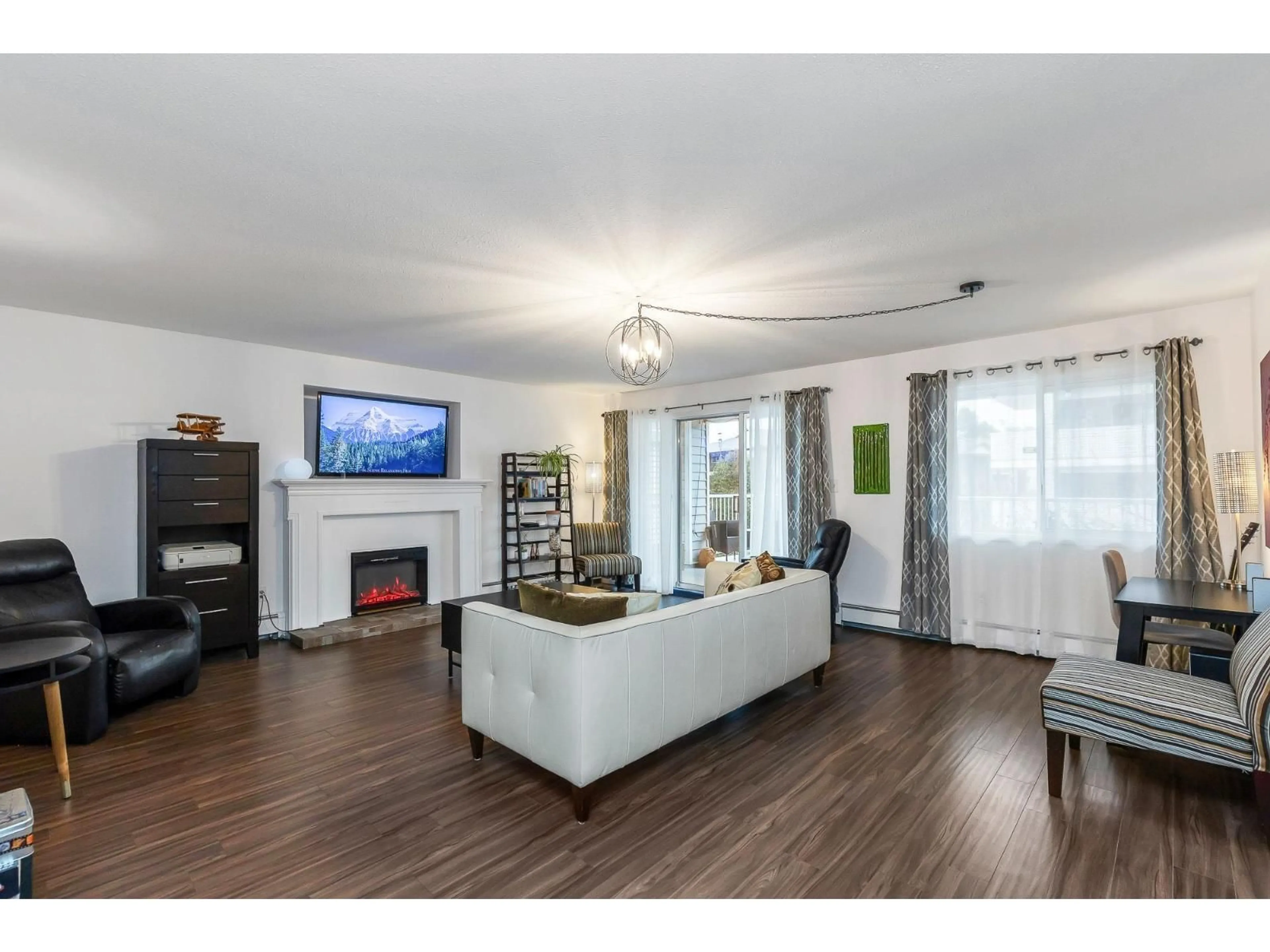 Living room with furniture, wood/laminate floor for 119 - 32833 LANDEAU PLACE, Abbotsford British Columbia V2S6S6
