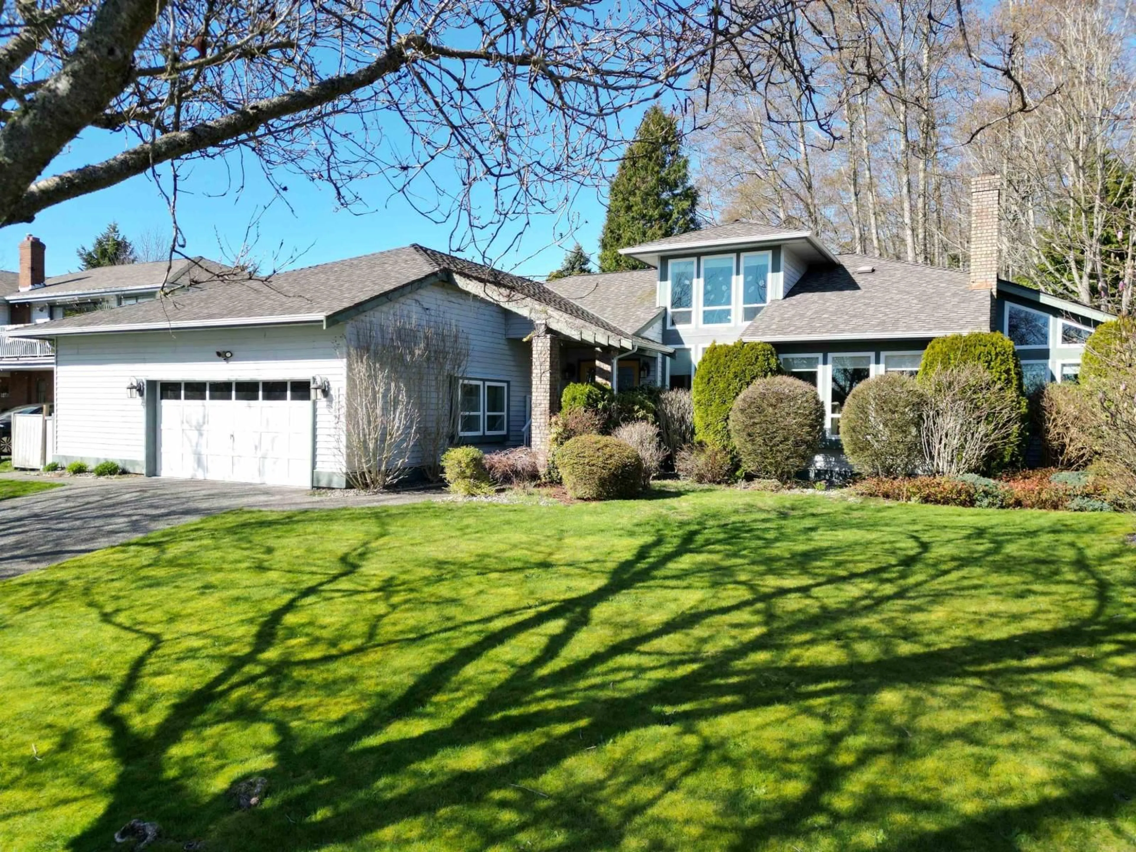 Home with vinyl exterior material, street for 13383 14A AVENUE, Surrey British Columbia V4A7P9