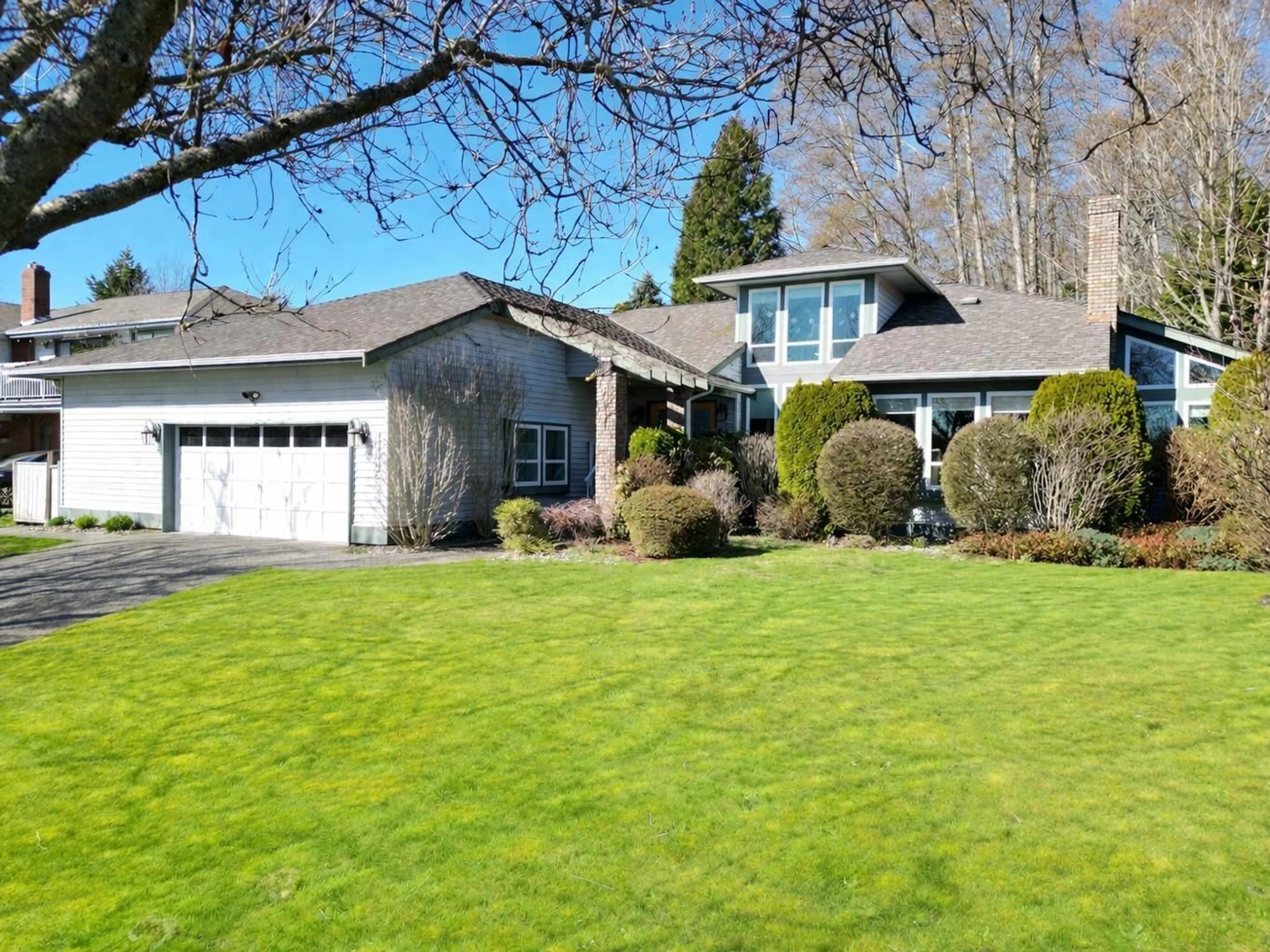 Home with vinyl exterior material, street for 13383 14A AVENUE, Surrey British Columbia V4A7P9