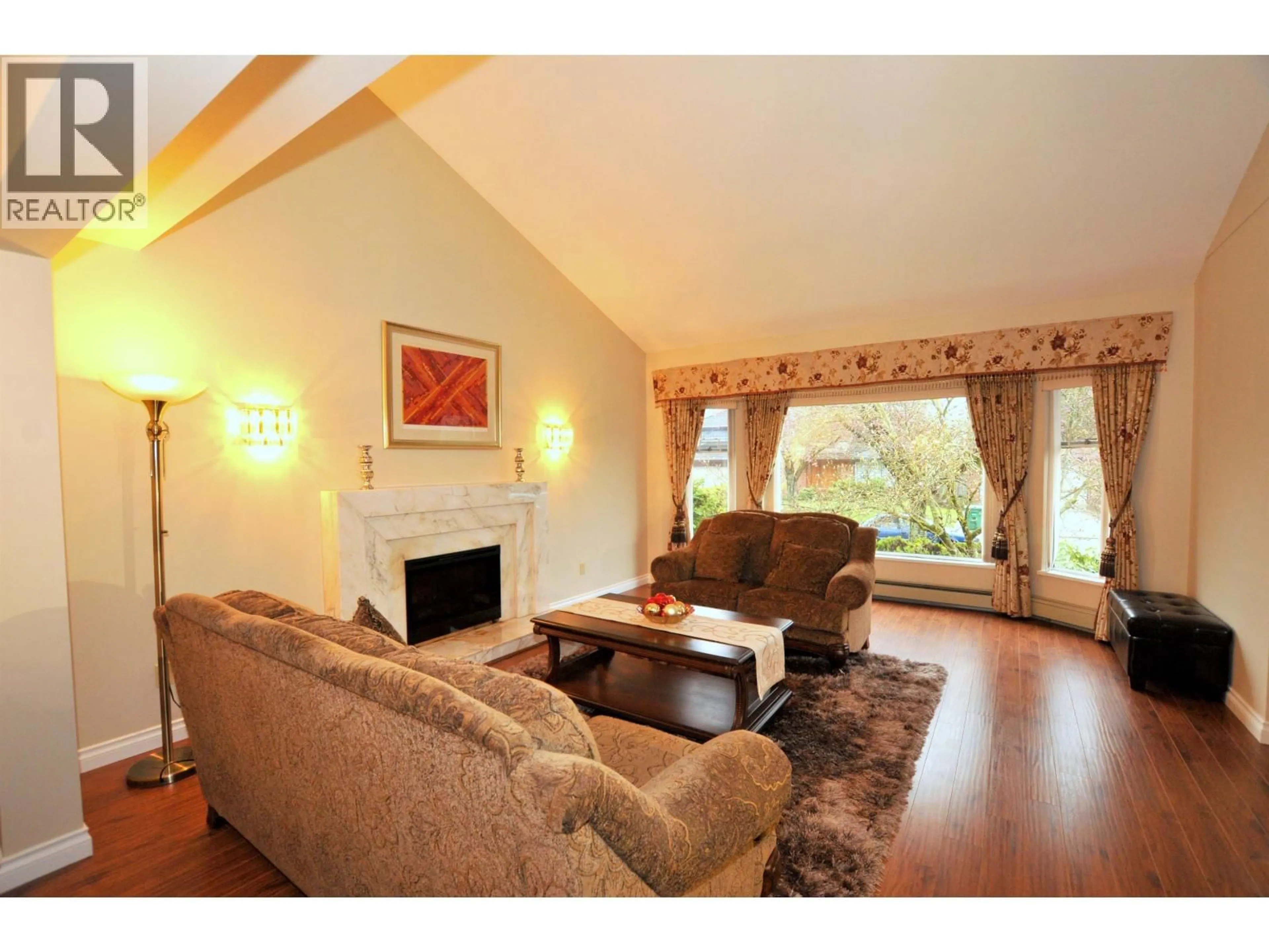 Living room with furniture, wood/laminate floor for 6823 GRANT PLACE, Burnaby British Columbia V5B4X4