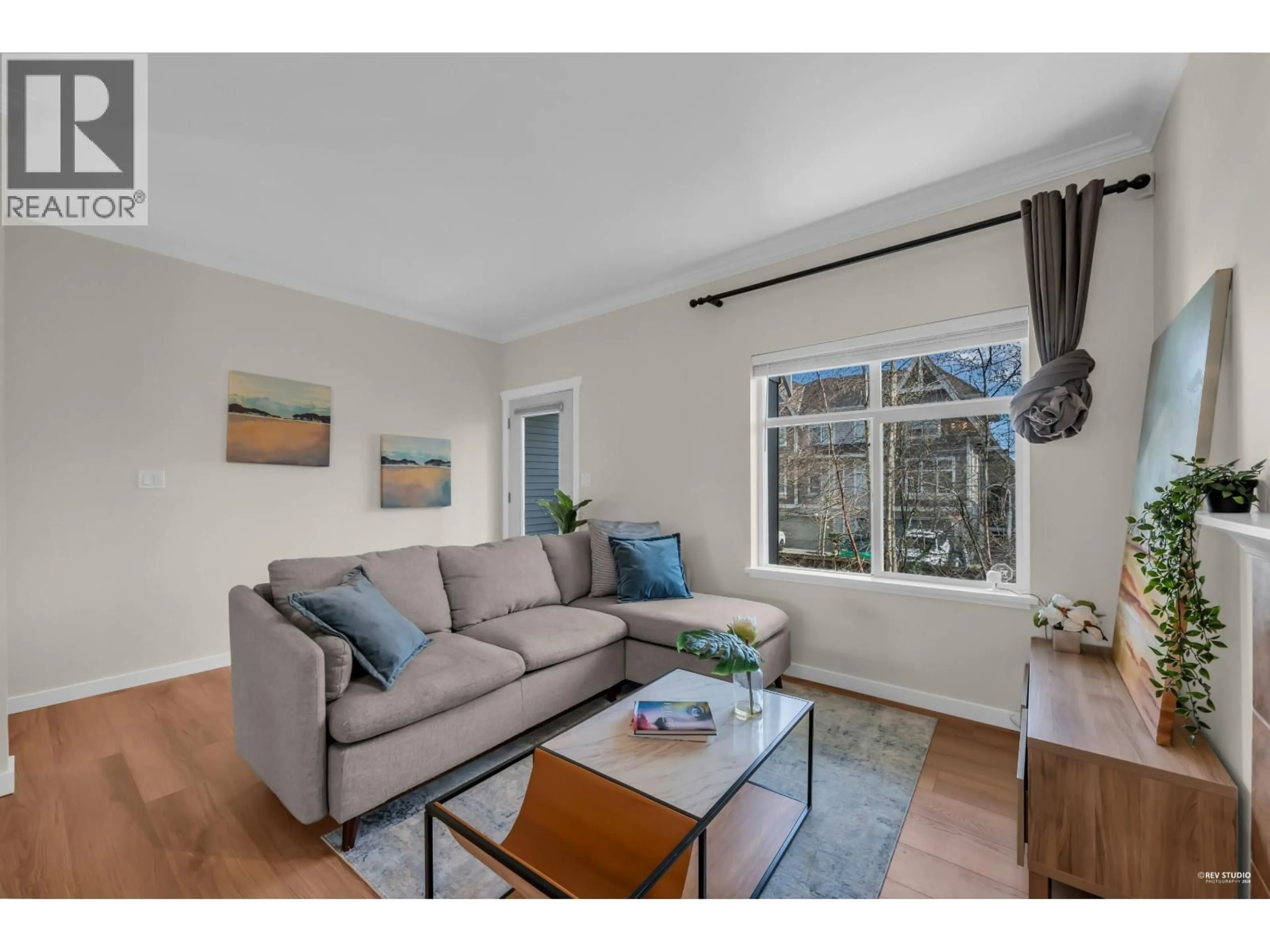 Living room with furniture, wood/laminate floor for 12 - 7322 HEATHER STREET, Richmond British Columbia V6Y2P6