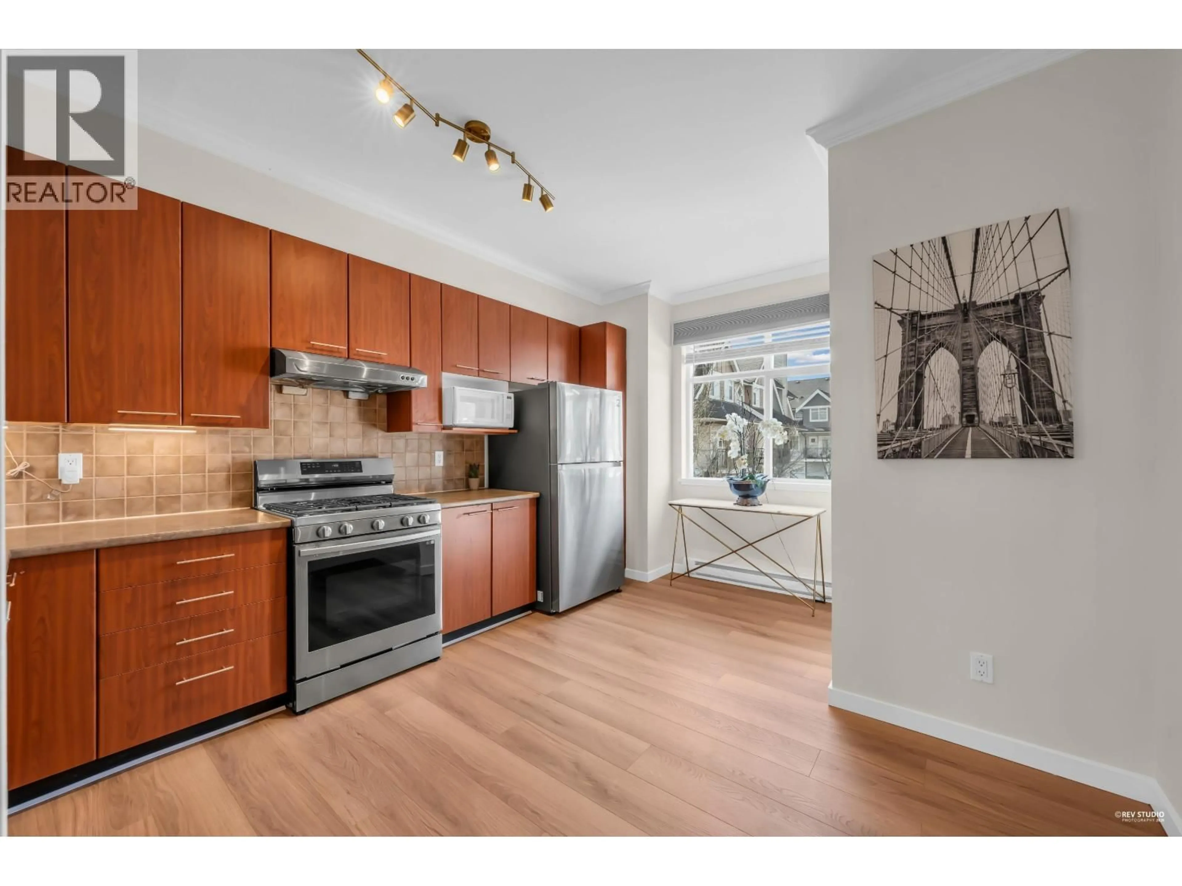Open concept kitchen, wood/laminate floor for 12 - 7322 HEATHER STREET, Richmond British Columbia V6Y2P6