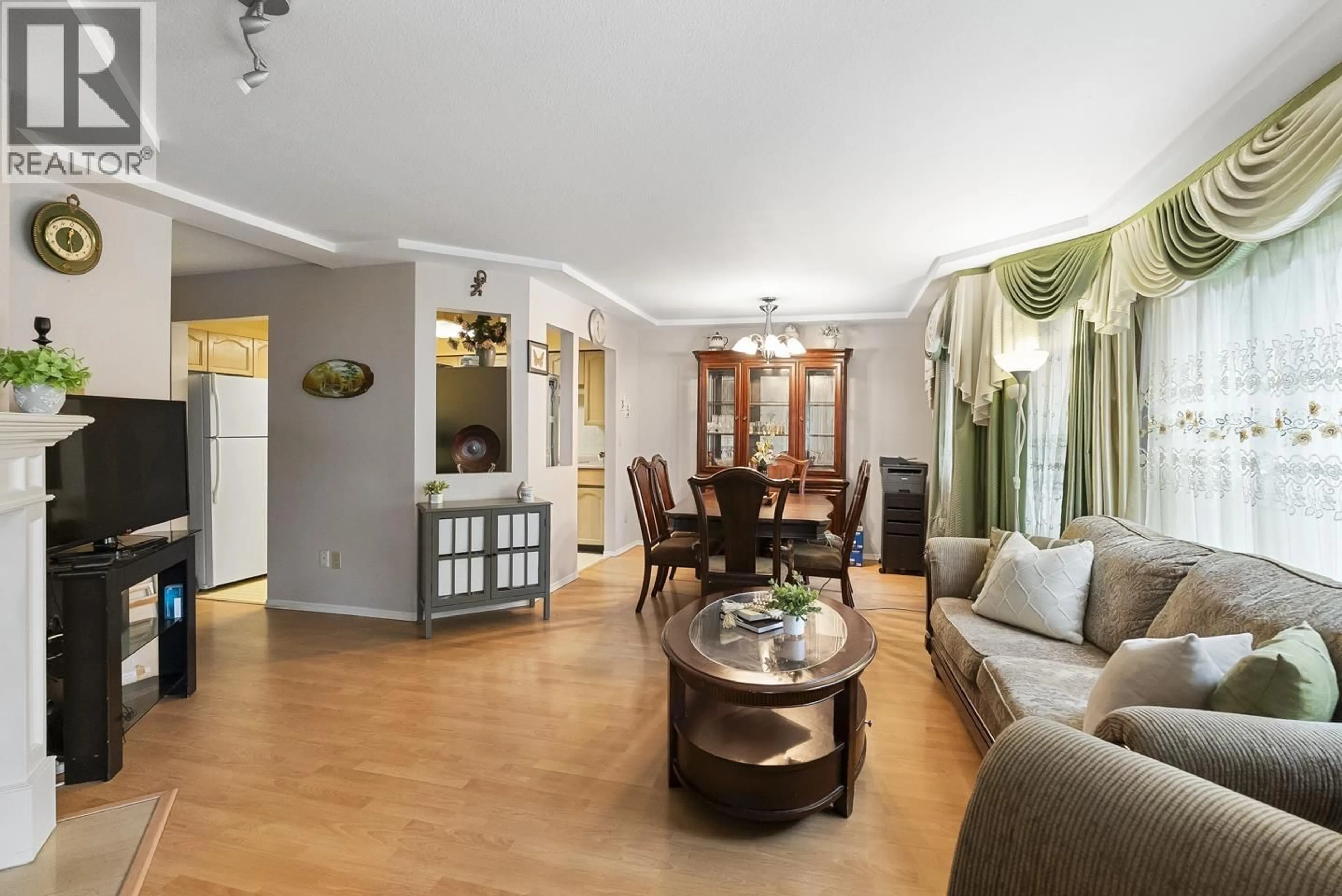 Living room with furniture, wood/laminate floor for 108 - 8611 ACKROYD ROAD, Richmond British Columbia V6X3P4