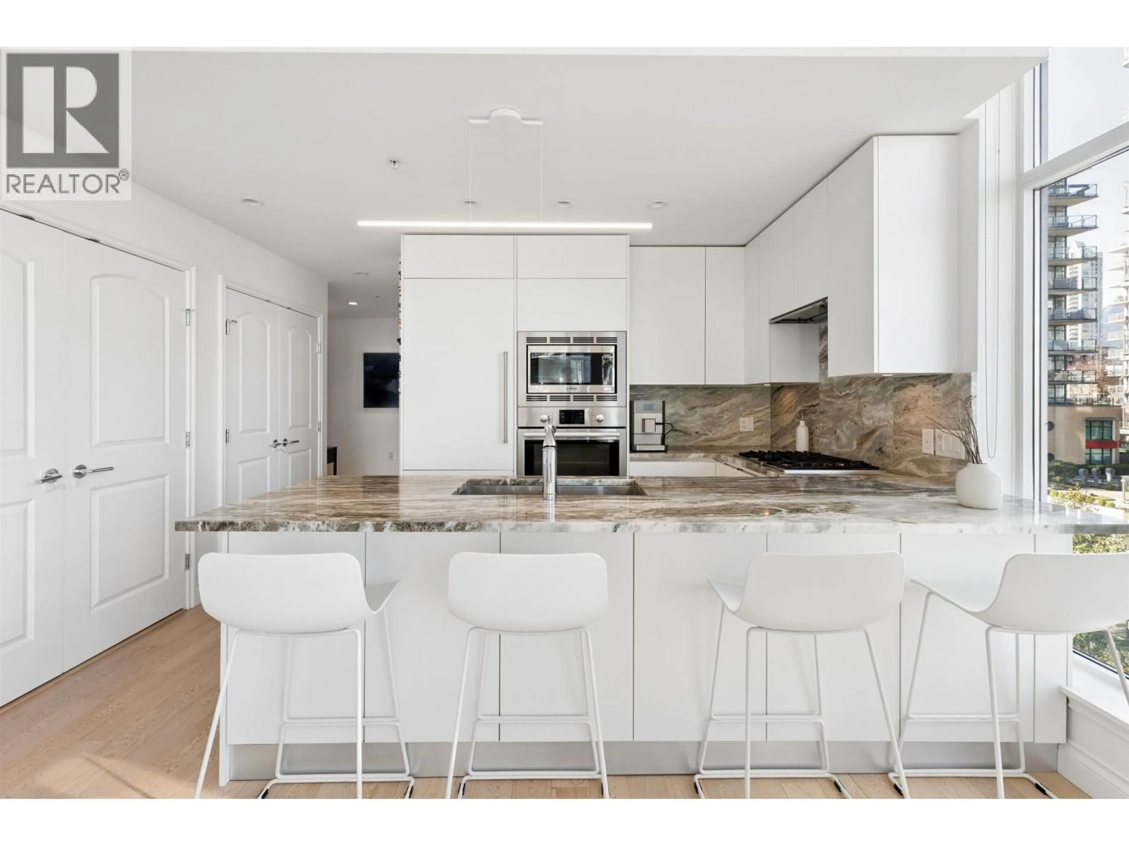 Contemporary kitchen, ceramic/tile floor for 409 - 185 VICTORY SHIP WAY, North Vancouver British Columbia V7L0G2