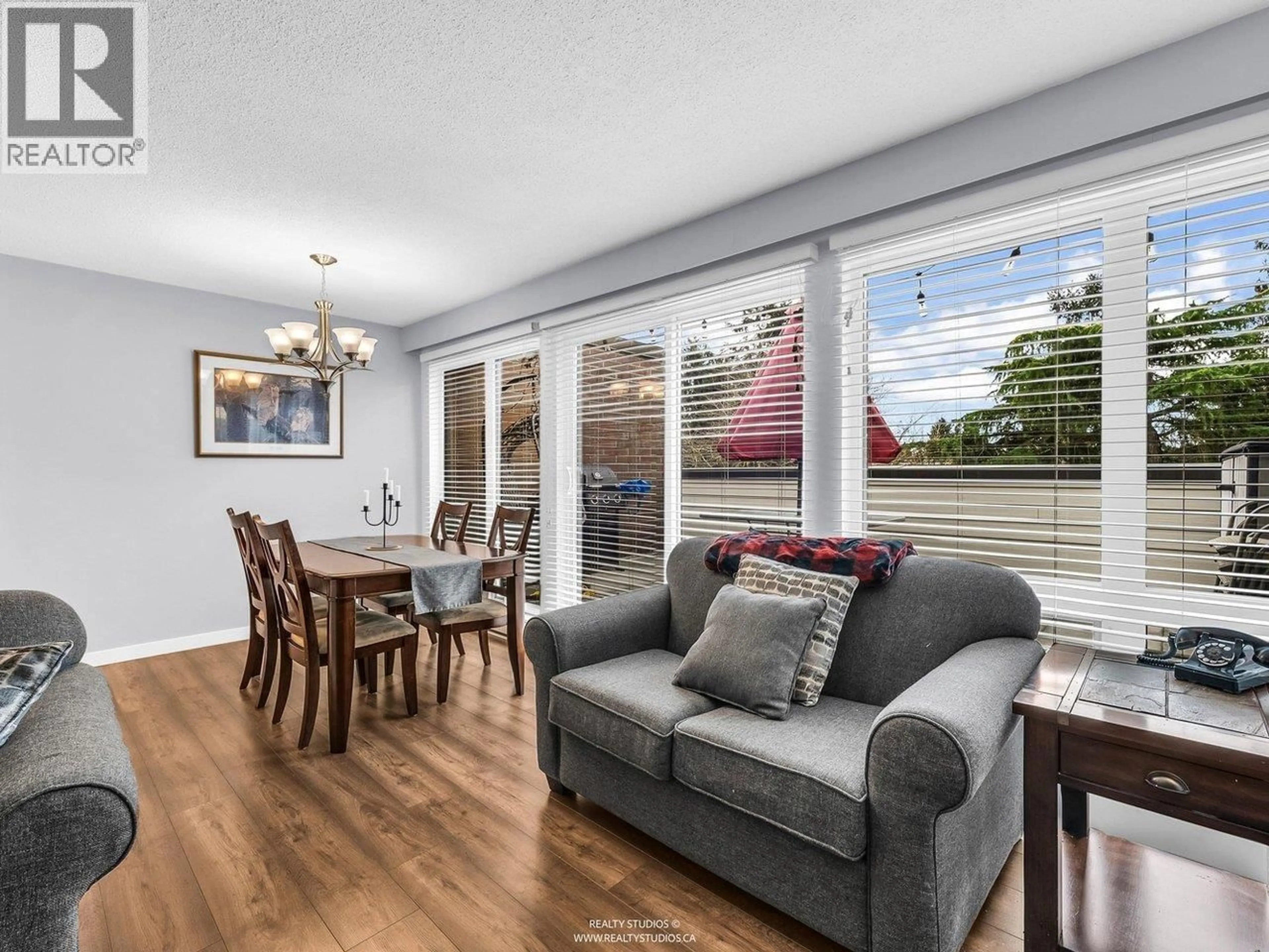 Living room with furniture, wood/laminate floor for 21 - 10200 4TH AVENUE, Richmond British Columbia V7E1V3