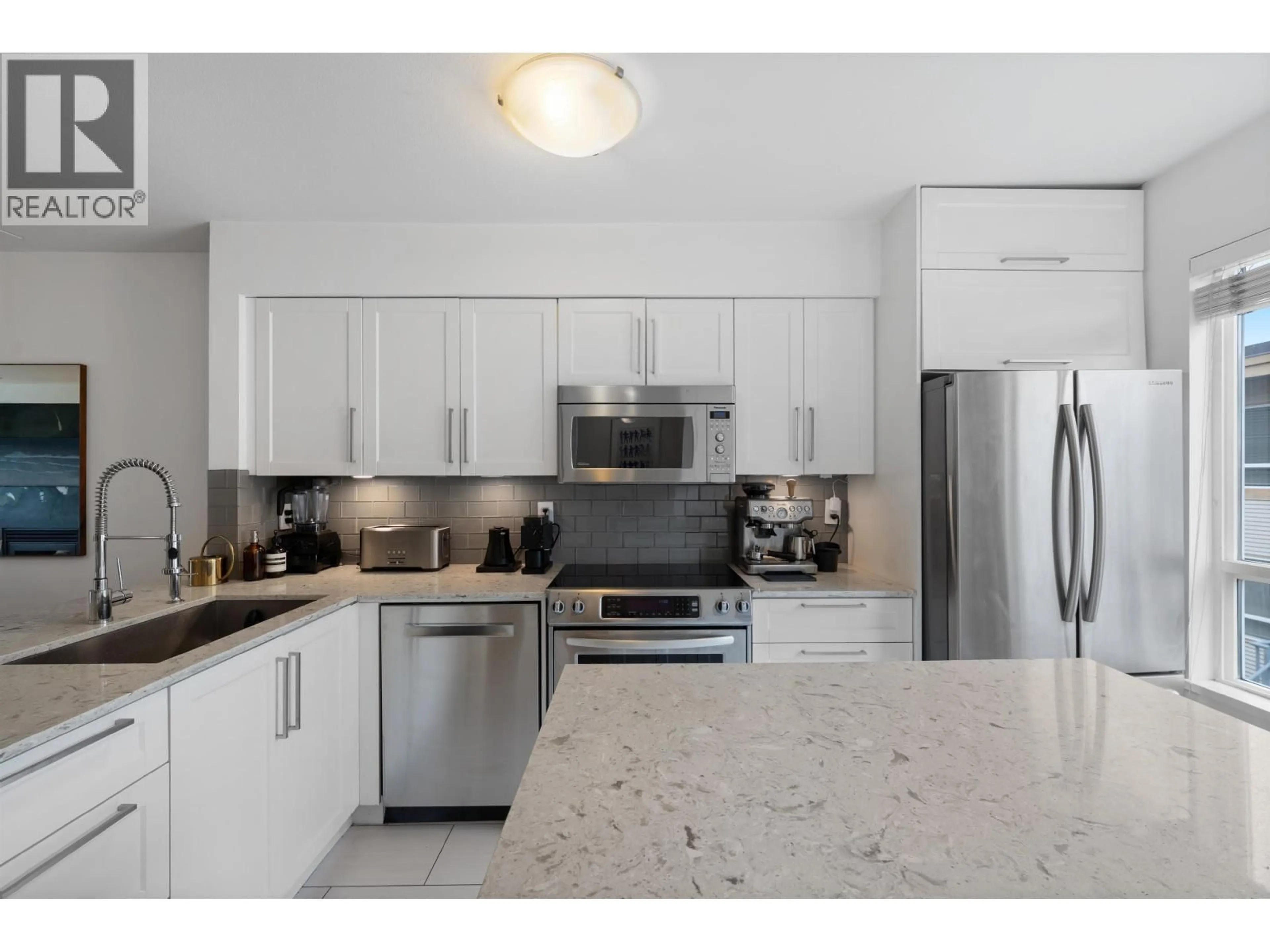 Open concept kitchen, ceramic/tile floor for 303 - 2688 WATSON STREET, Vancouver British Columbia V5T4T6