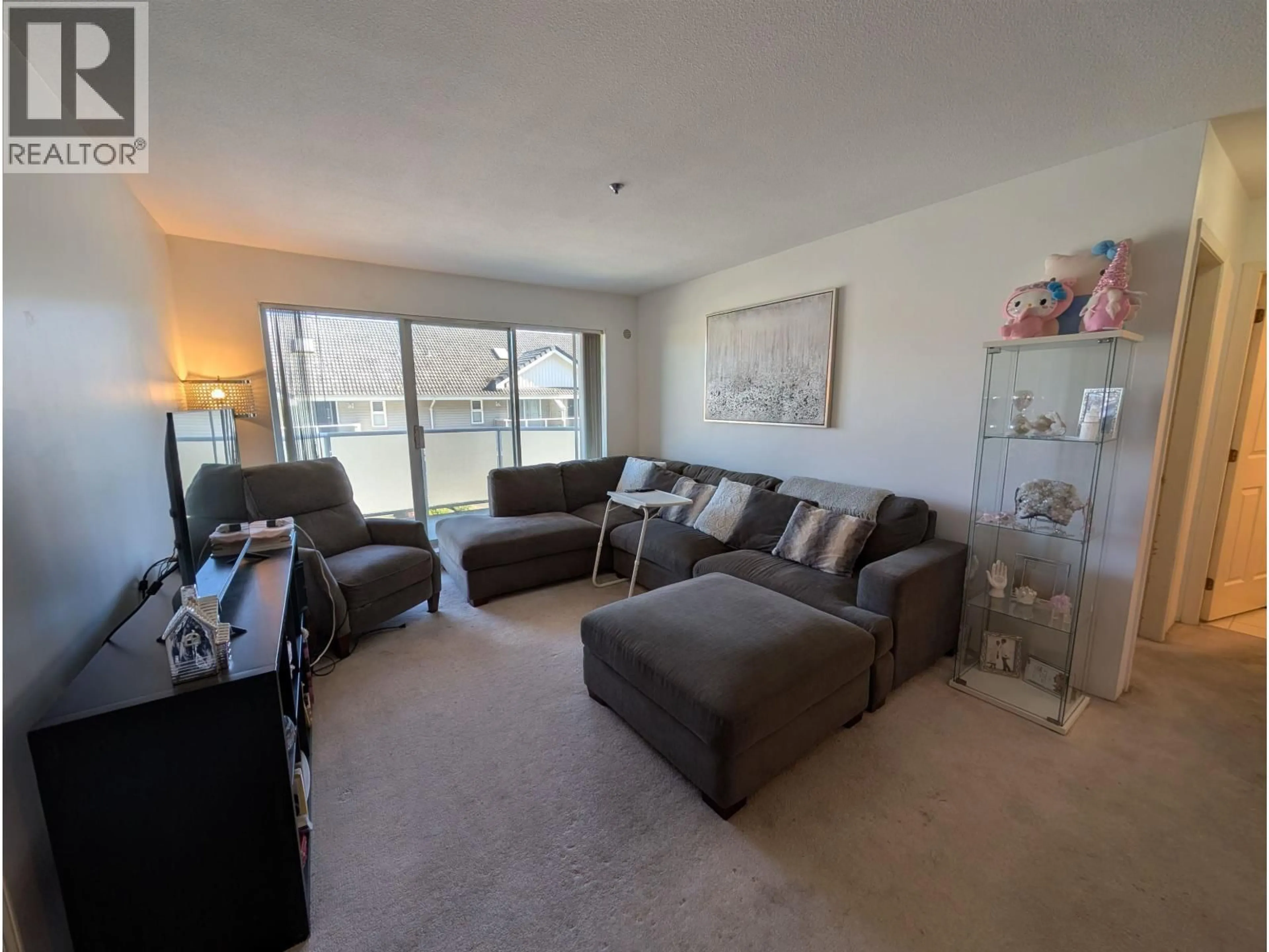Living room with furniture, unknown for 204 - 7071 BLUNDELL ROAD, Richmond British Columbia V6Y1J5