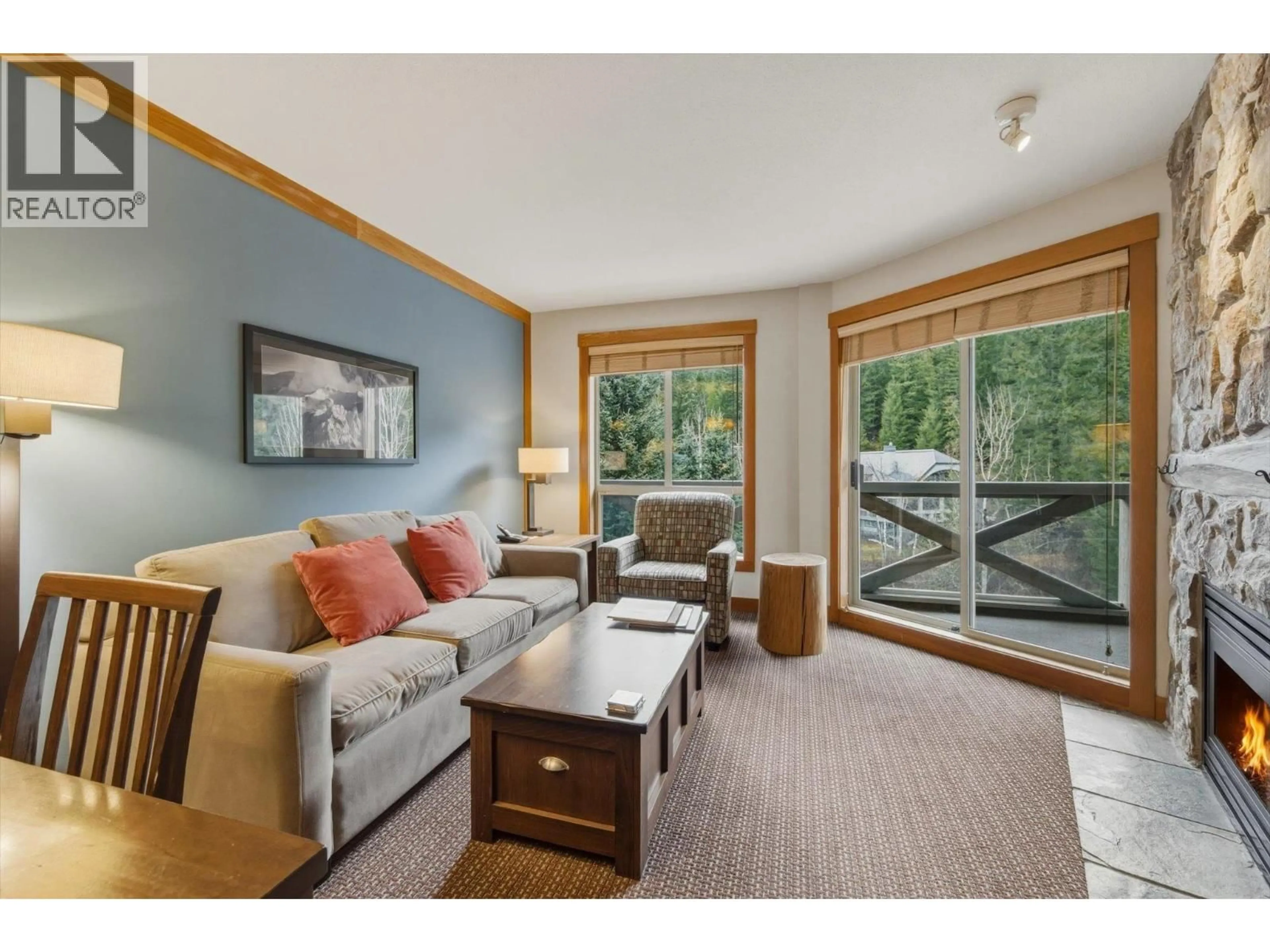 Living room with furniture, wood/laminate floor for 416C - 2036 LONDON LANE, Whistler British Columbia V8E0N7