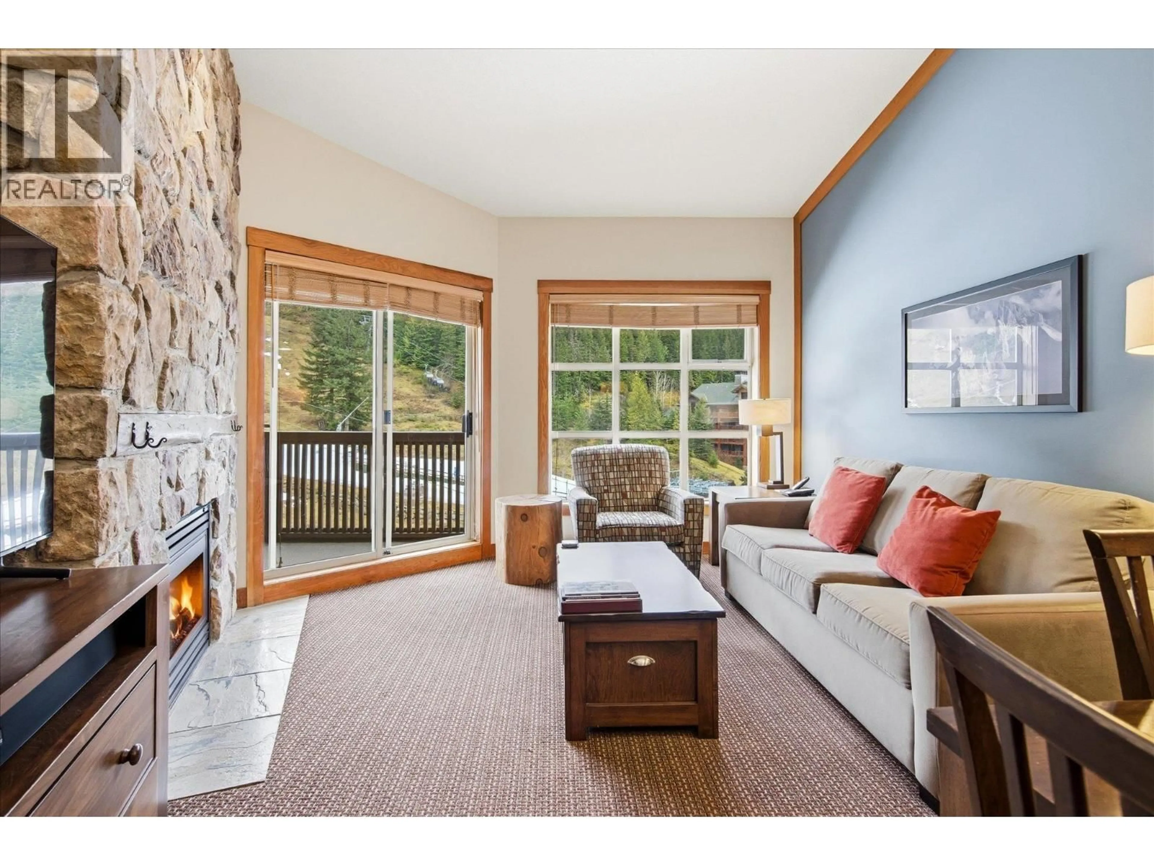 Living room with furniture, wood/laminate floor for 637B - 2036 LONDON LANE, Whistler British Columbia V8E0N7