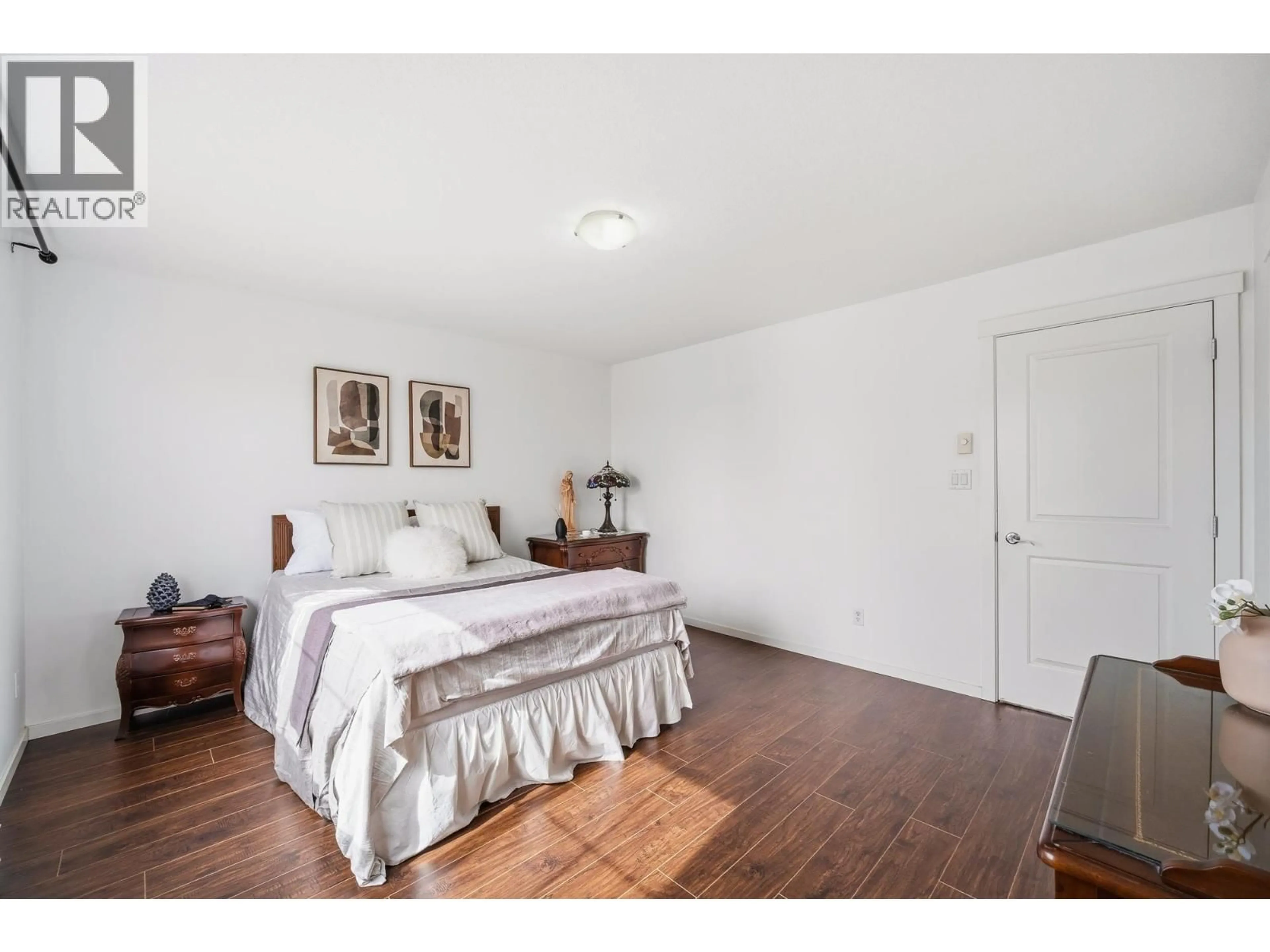 Bedroom with bed, wood/laminate floor for 74 - 1357 PURCELL DRIVE, Coquitlam British Columbia V3E0C1