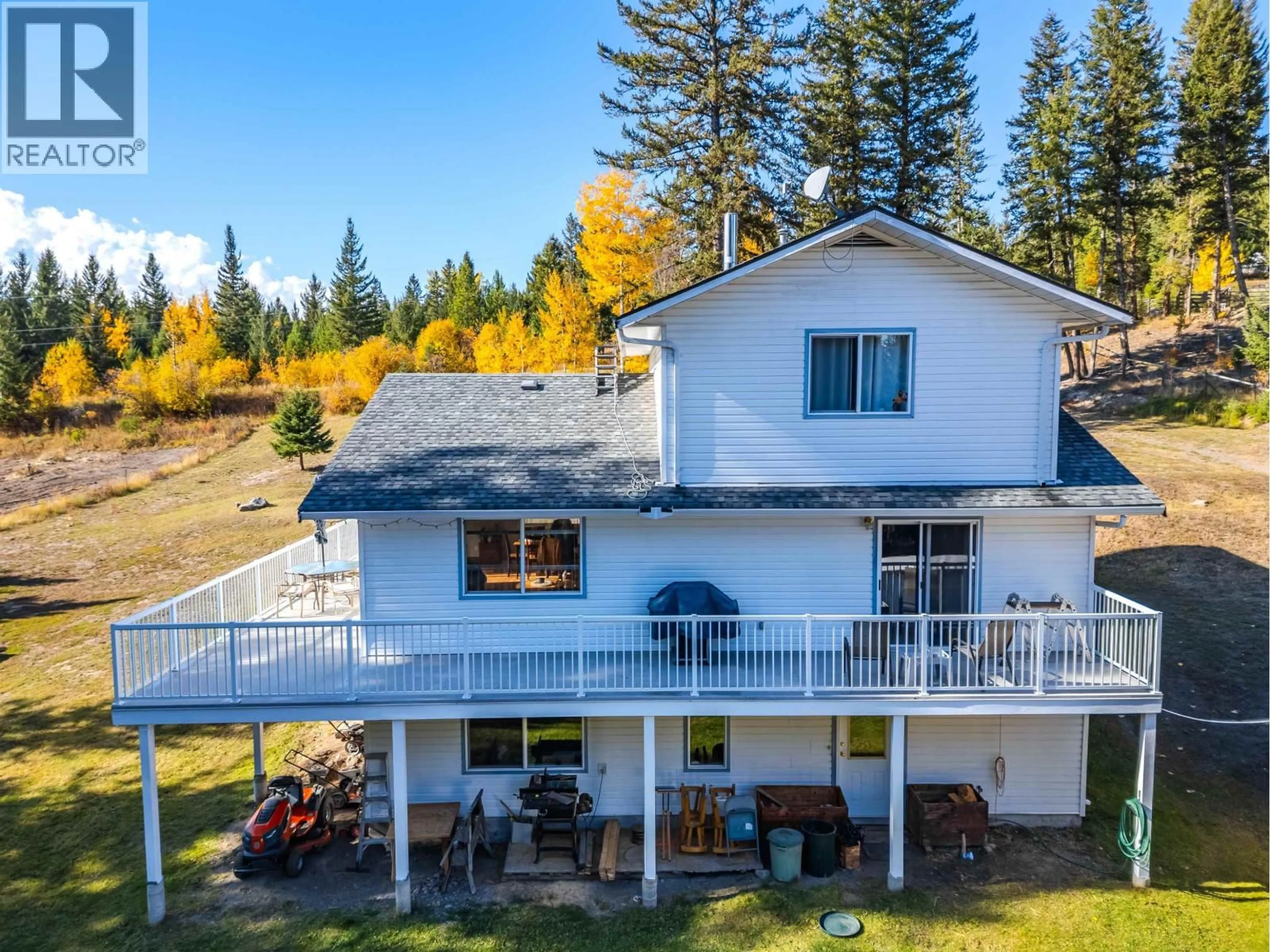 A pic from outside/outdoor area/front of a property/back of a property/a pic from drone, water/lake/river/ocean view for 5565 BIRCHWOOD ROAD, 100 Mile House British Columbia V0K2E1