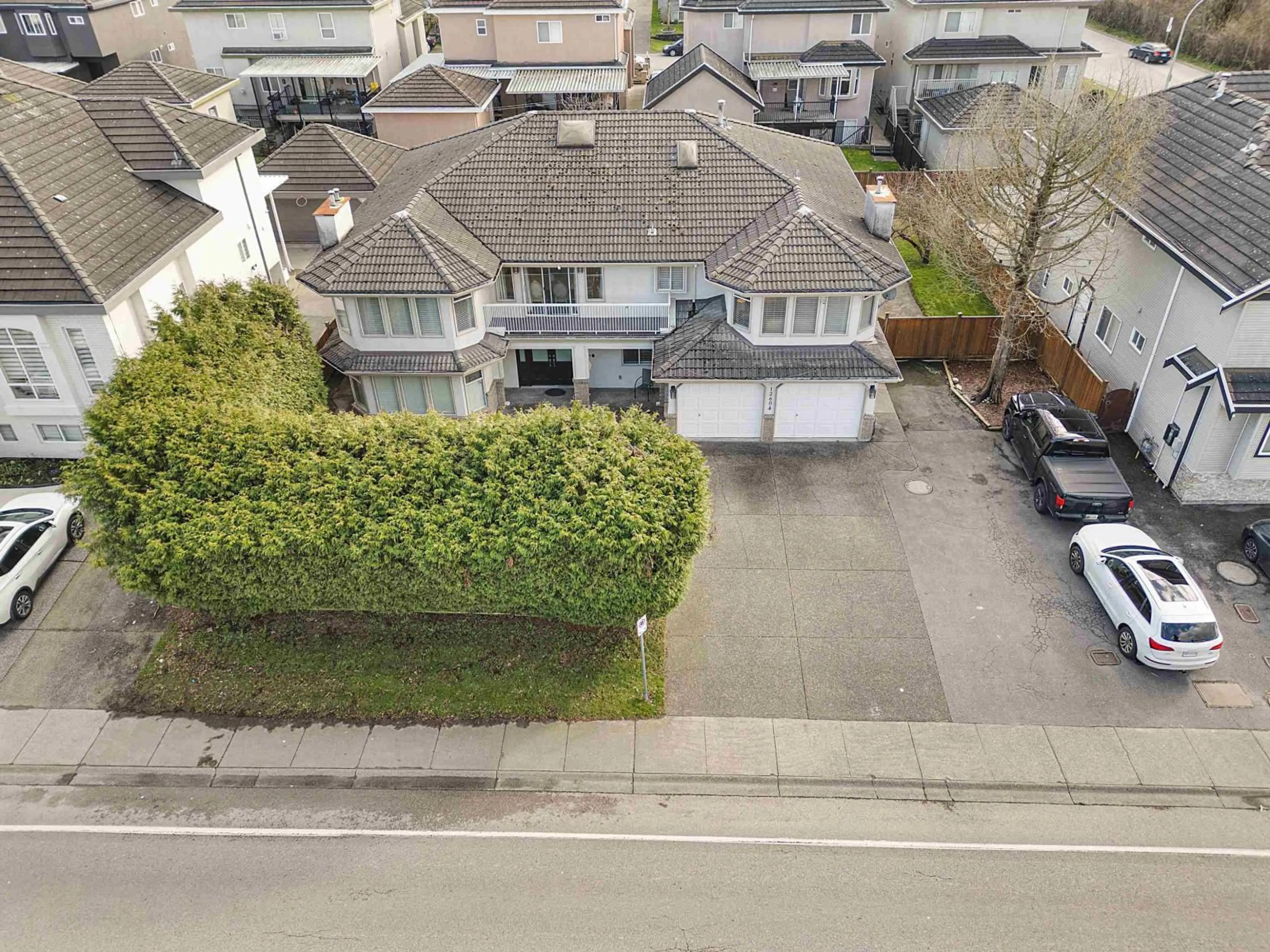 A pic from outside/outdoor area/front of a property/back of a property/a pic from drone, street for 12604 68 AVENUE, Surrey British Columbia V3W1G4