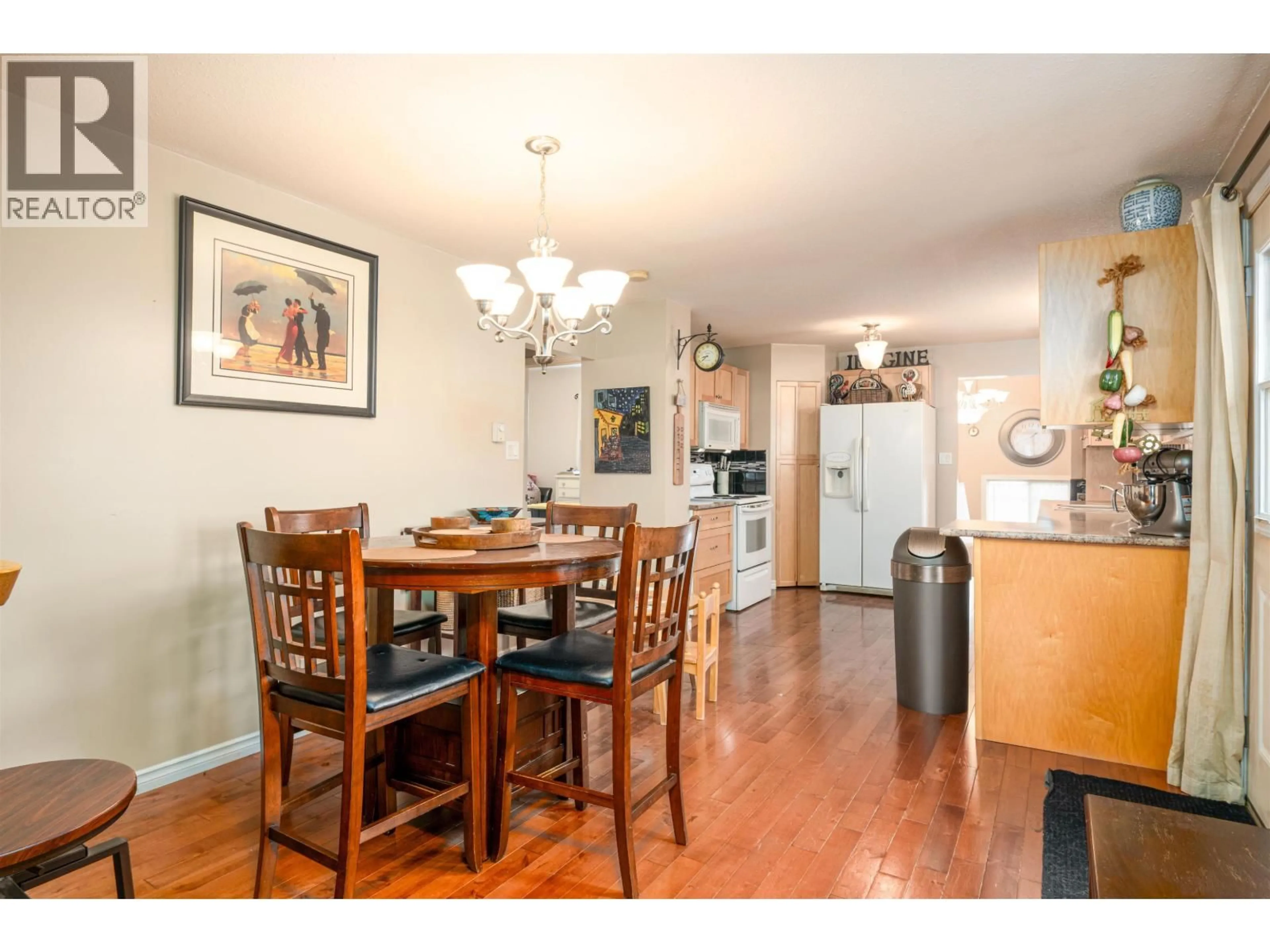 Dining room, wood/laminate floor for 1728 MAPLE STREET, Prince George British Columbia V2L1X1